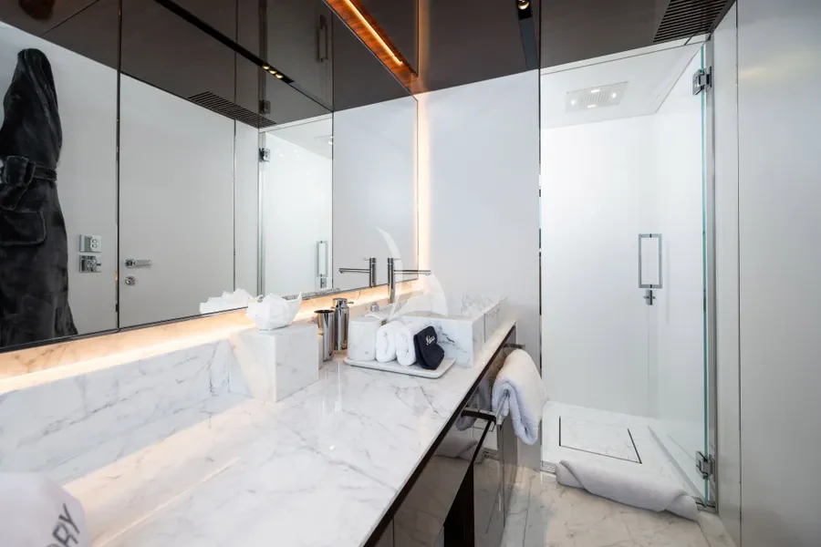 a bathroom with a countertop sink and mirror aboard TASTY WAVES Yacht for Charter