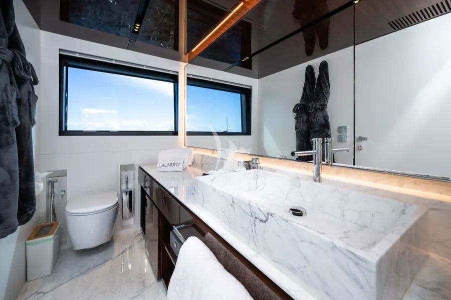 a bathroom with a large bathtub aboard TASTY WAVES Yacht for Charter