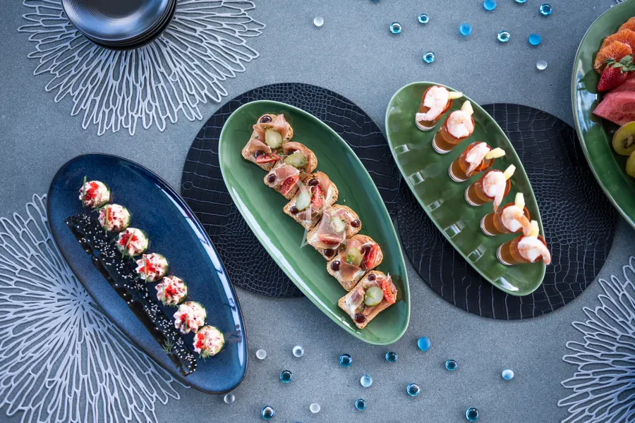 a group of plates with food on them aboard TASTY WAVES Yacht for Charter