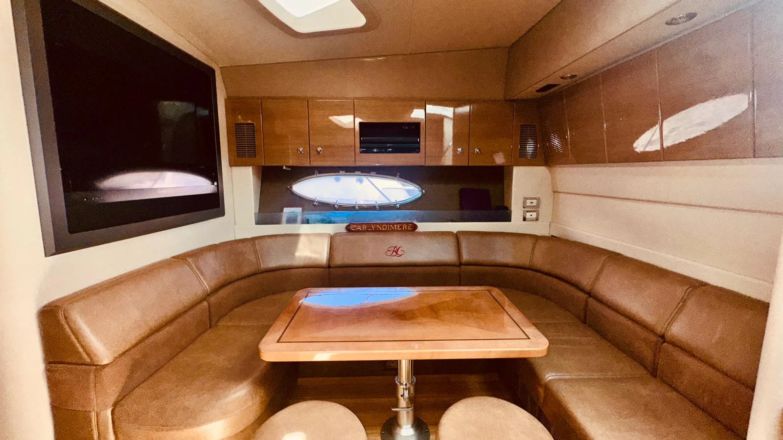 a living room with a couch and a table aboard MODERATION Yacht for Sale