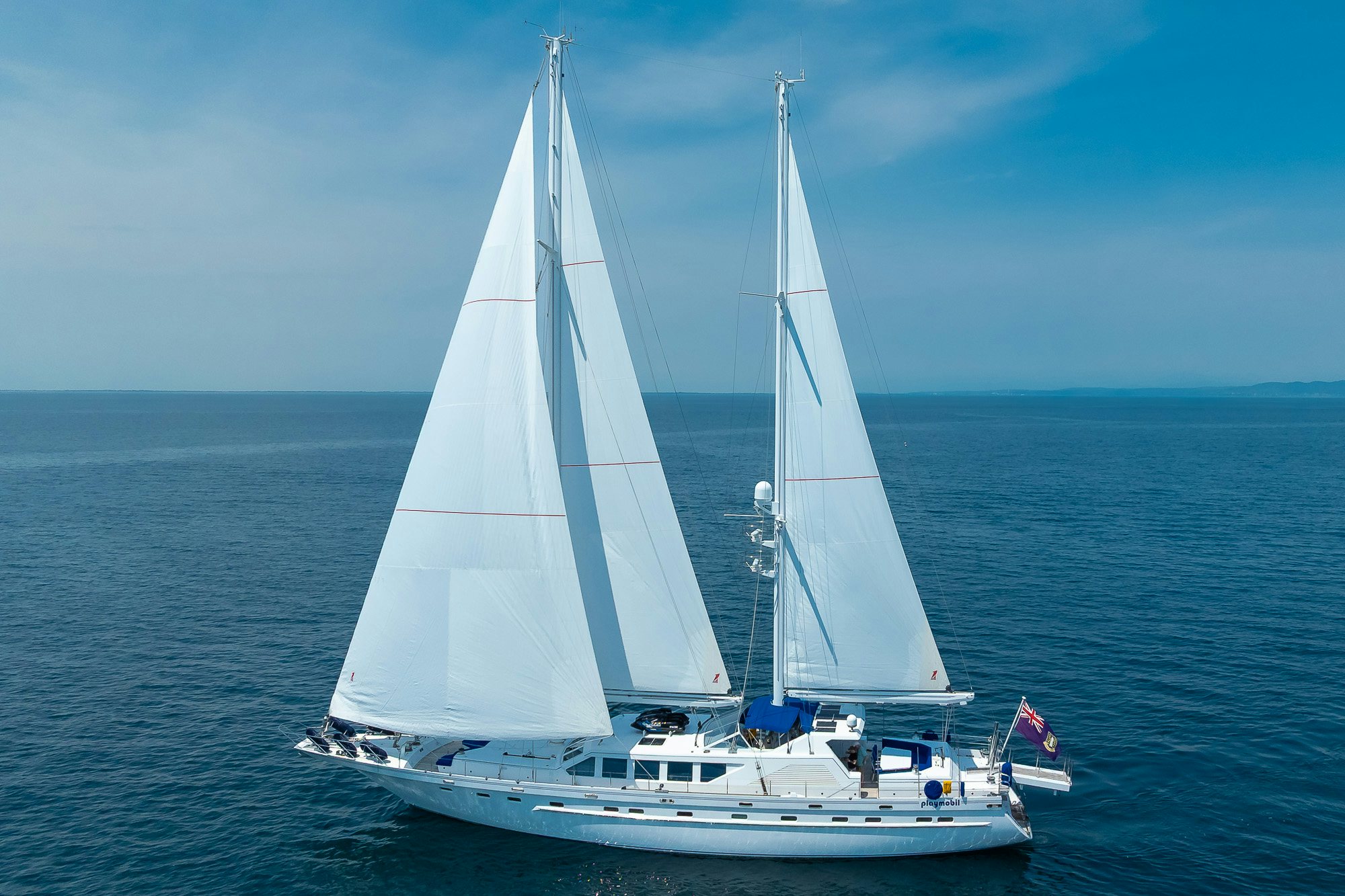 a white sailboat on the water aboard PLAYMOBIL Yacht for Sale