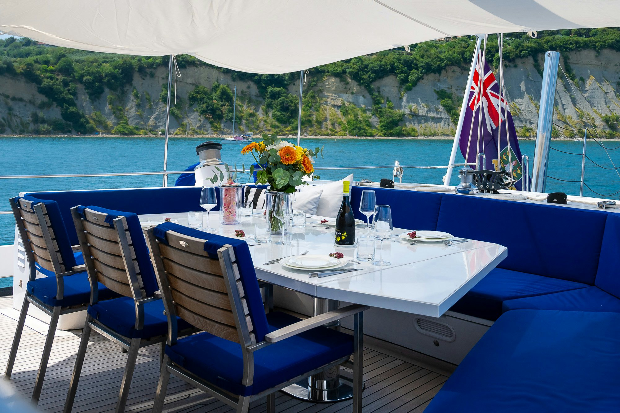 a table set for a meal on a boat aboard PLAYMOBIL Yacht for Sale