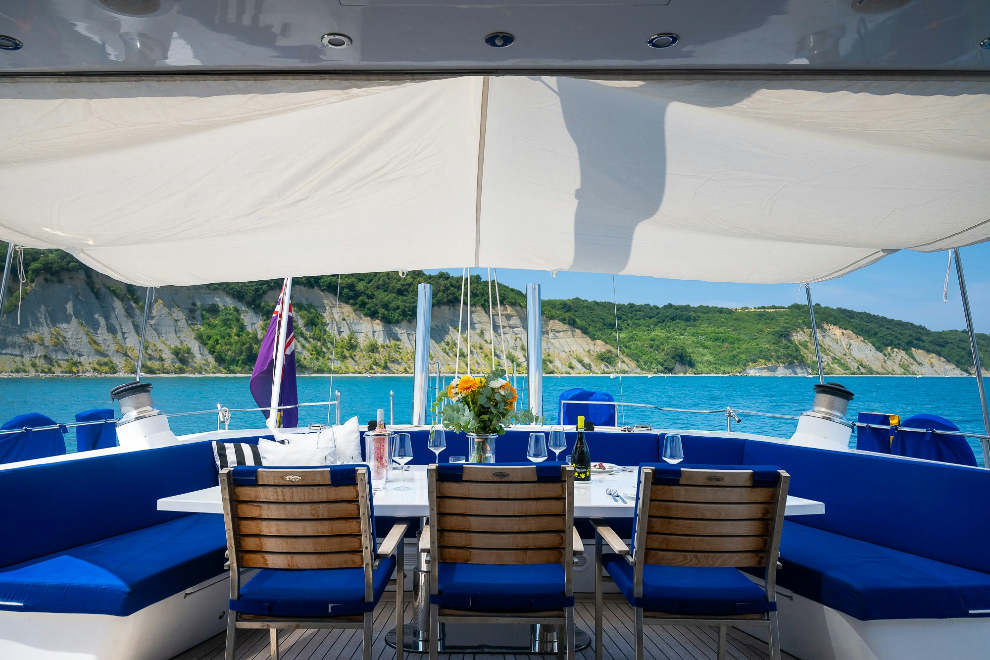 a boat with chairs and tables aboard PLAYMOBIL Yacht for Sale