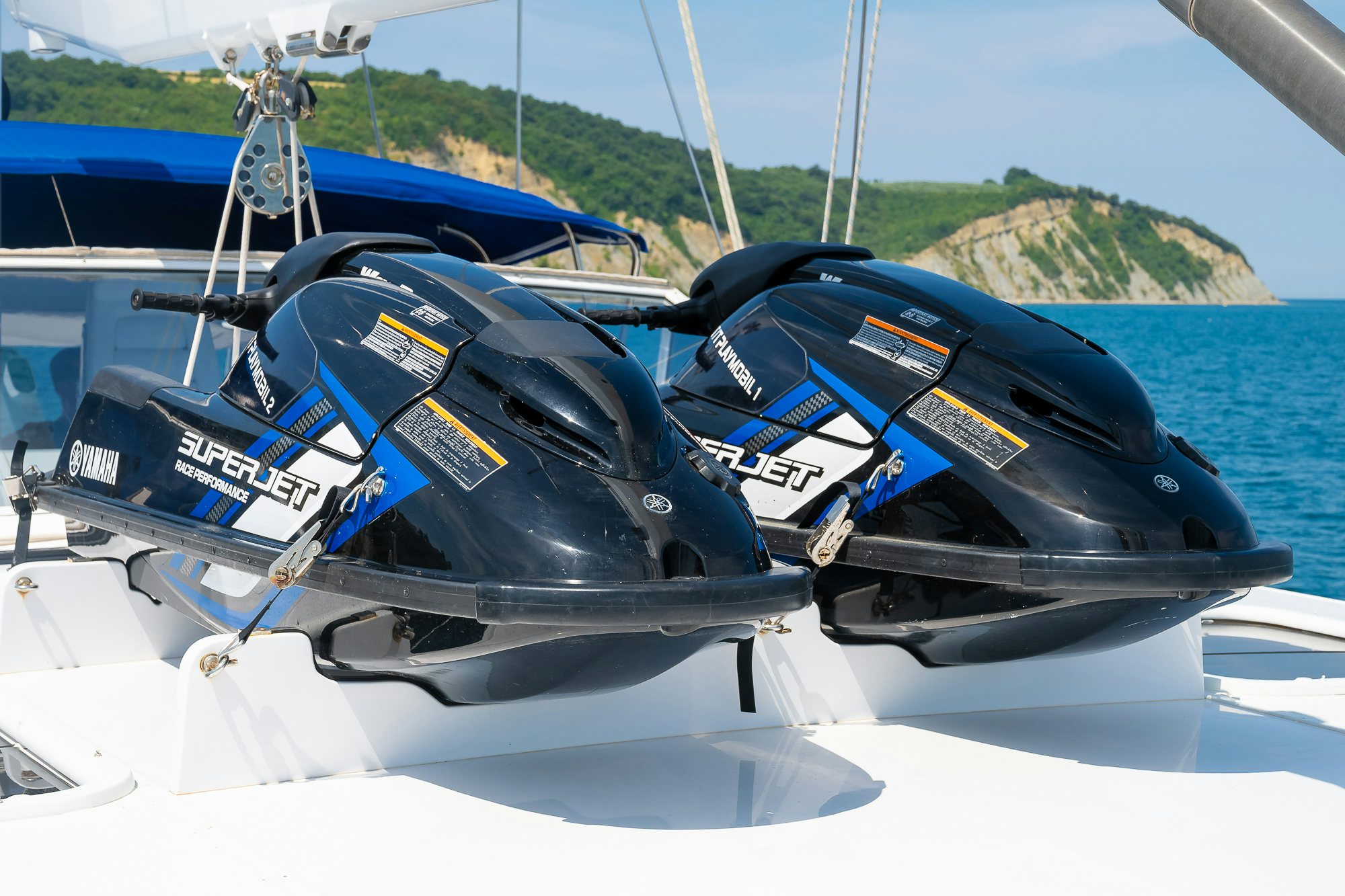 a boat with a black seat and a blue sea aboard PLAYMOBIL Yacht for Sale