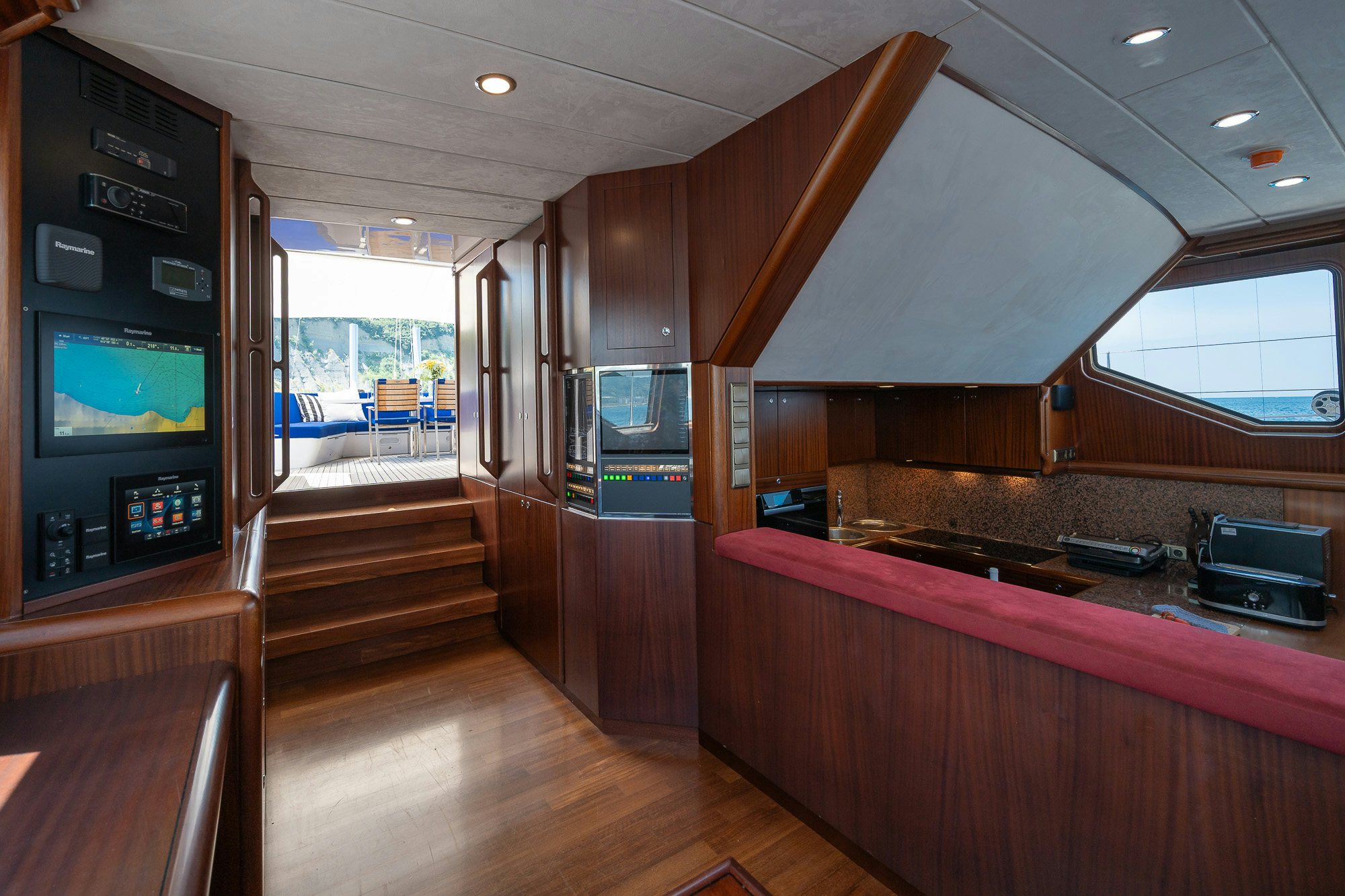 a kitchen with a wood floor aboard PLAYMOBIL Yacht for Sale