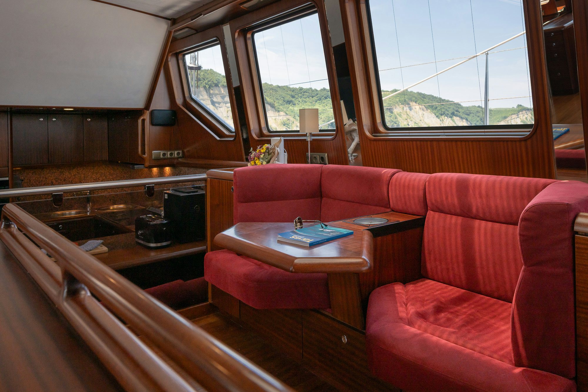 a living room with a couch and a table aboard PLAYMOBIL Yacht for Sale