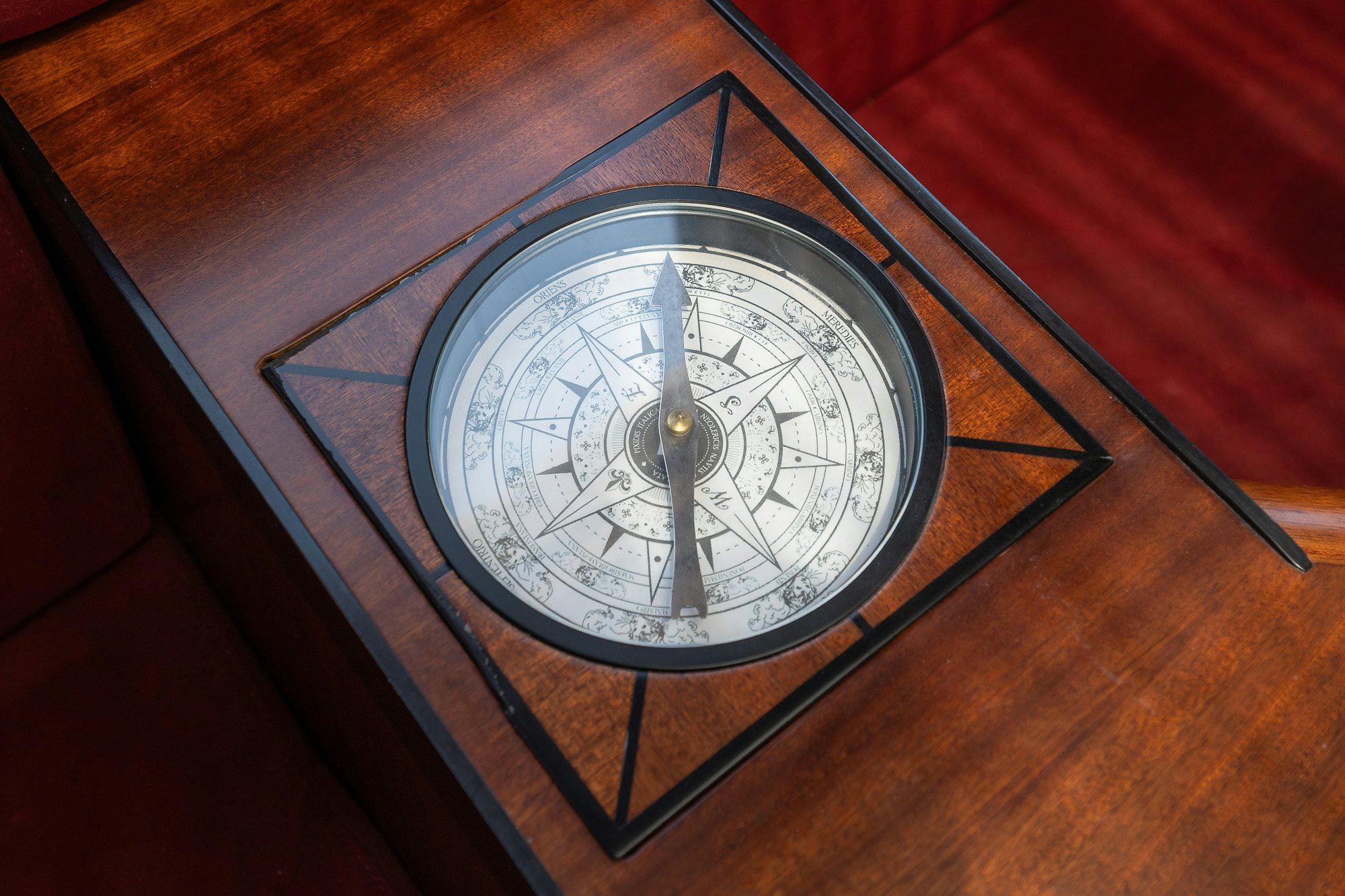 a round clock on a wooden surface aboard PLAYMOBIL Yacht for Sale