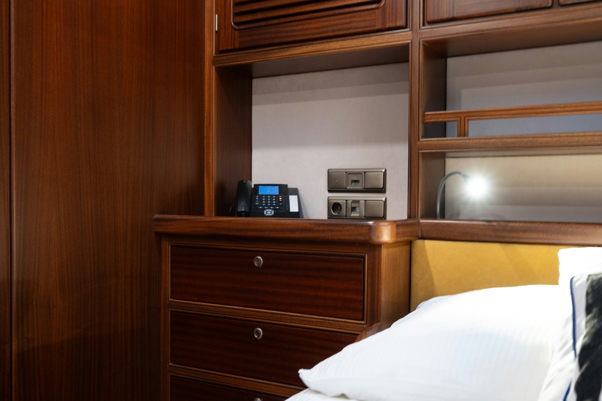 a room with a bed and a radio aboard PLAYMOBIL Yacht for Sale