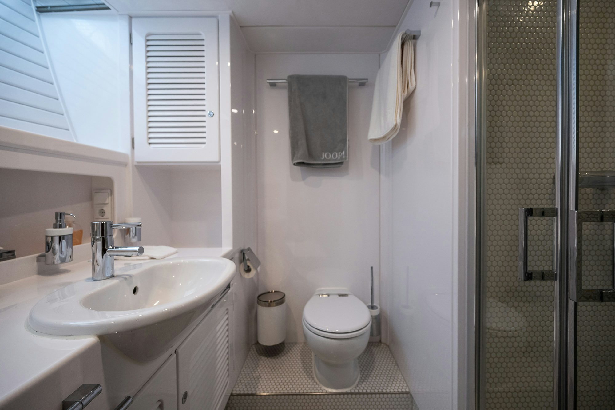 a bathroom with a sink toilet and a shower unit aboard PLAYMOBIL Yacht for Sale