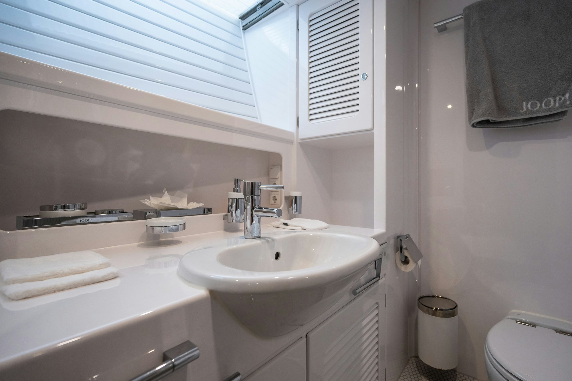 a bathroom with a sink and a towel aboard PLAYMOBIL Yacht for Sale