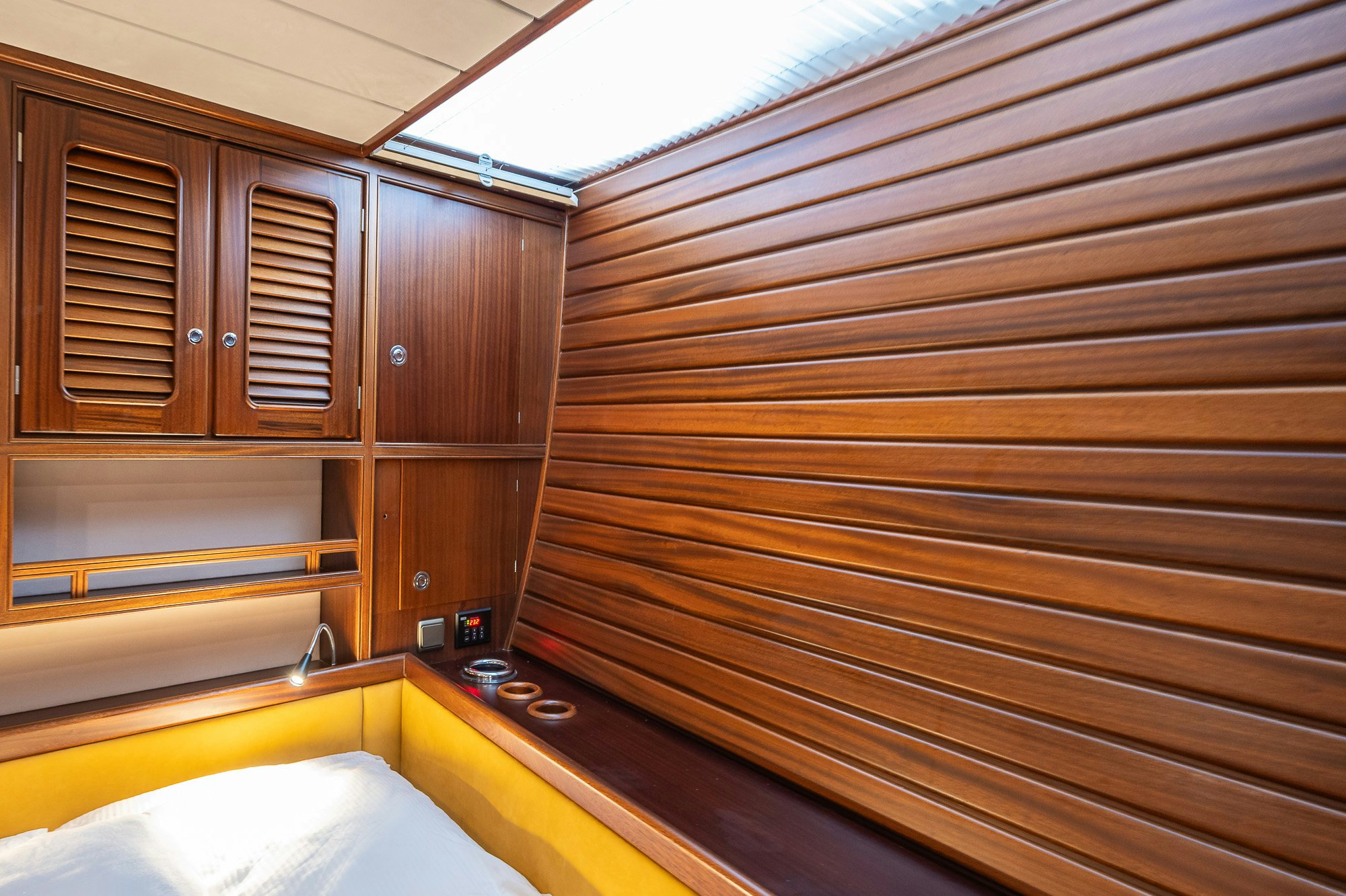 a wooden room with a wood wall aboard PLAYMOBIL Yacht for Sale