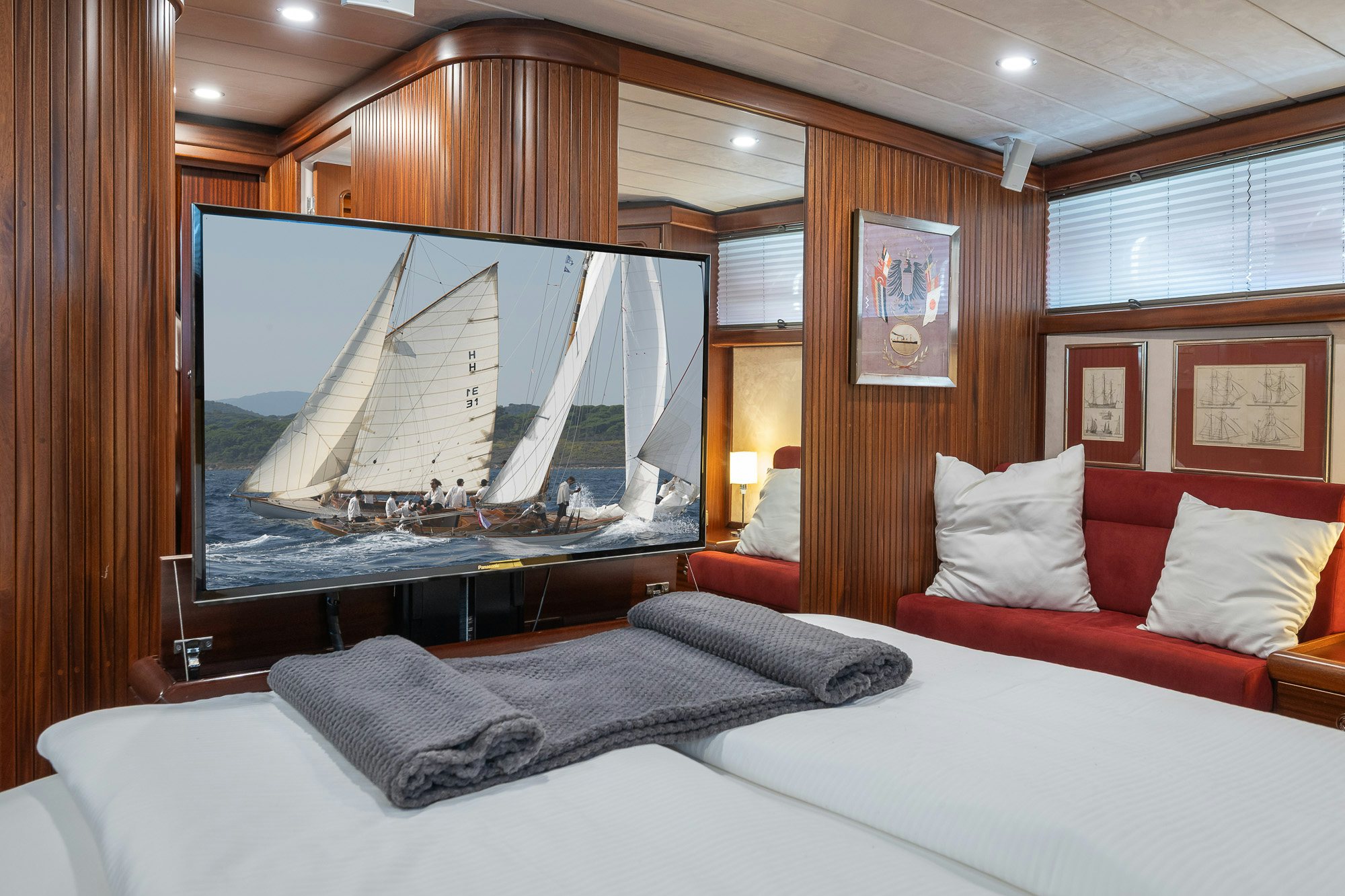 a bed with a television on aboard PLAYMOBIL Yacht for Sale