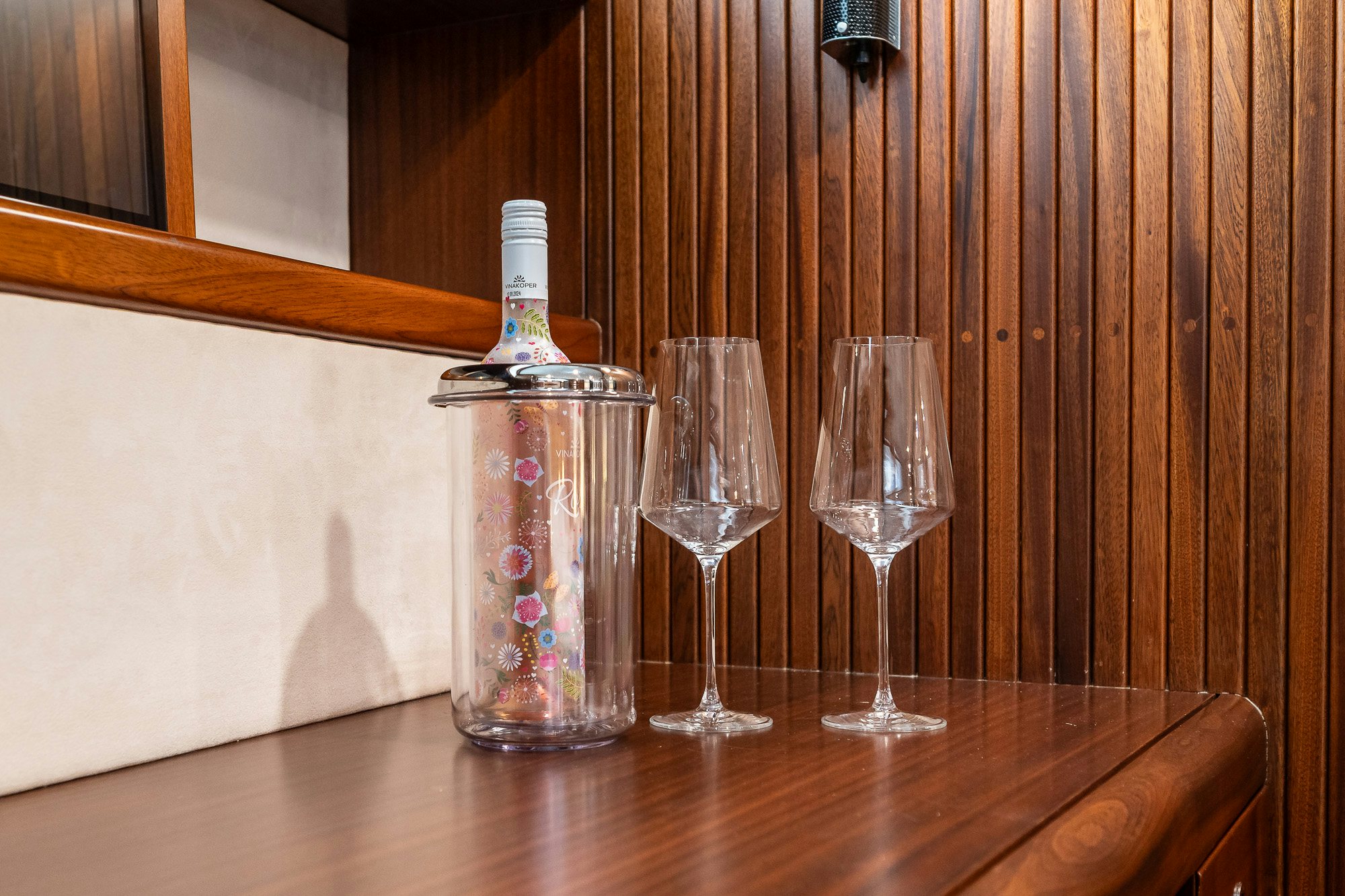 a bottle of alcohol and two glasses aboard PLAYMOBIL Yacht for Sale