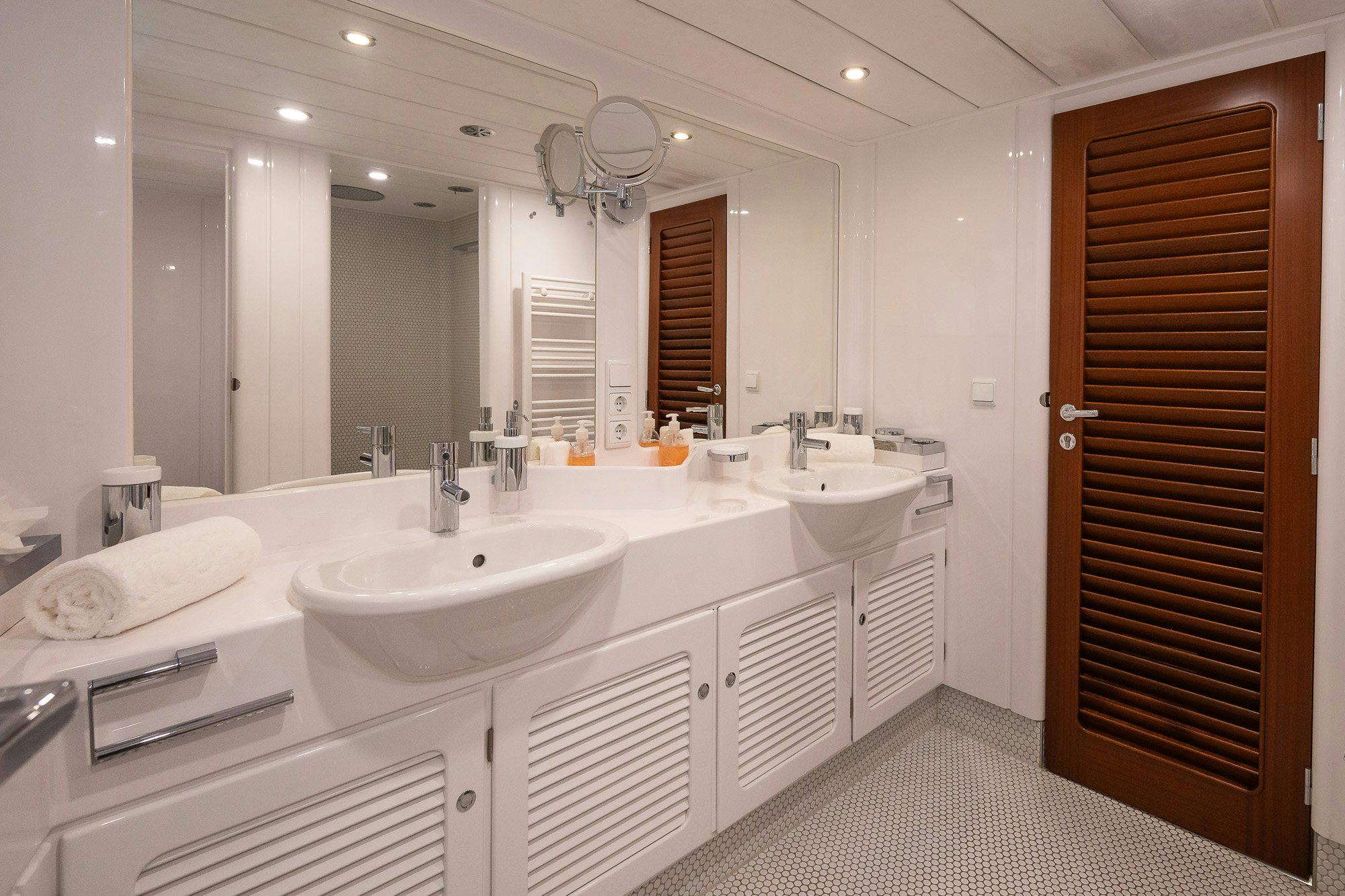 a bathroom with a sink and a mirror aboard PLAYMOBIL Yacht for Sale