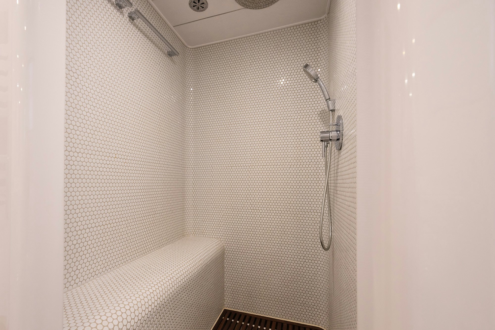 a shower with a white towel from it aboard PLAYMOBIL Yacht for Sale