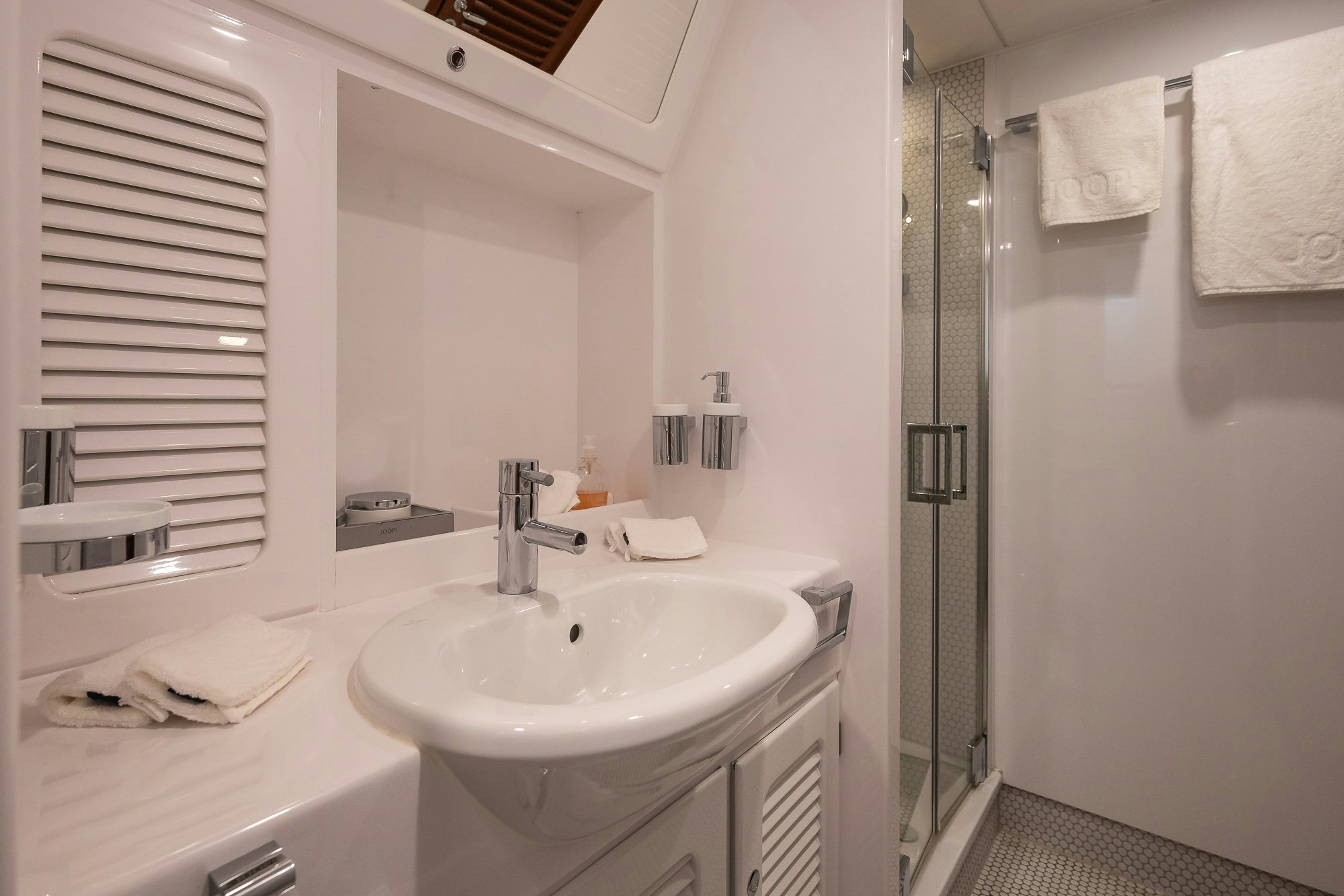 a bathroom with a sink and a shower aboard PLAYMOBIL Yacht for Sale