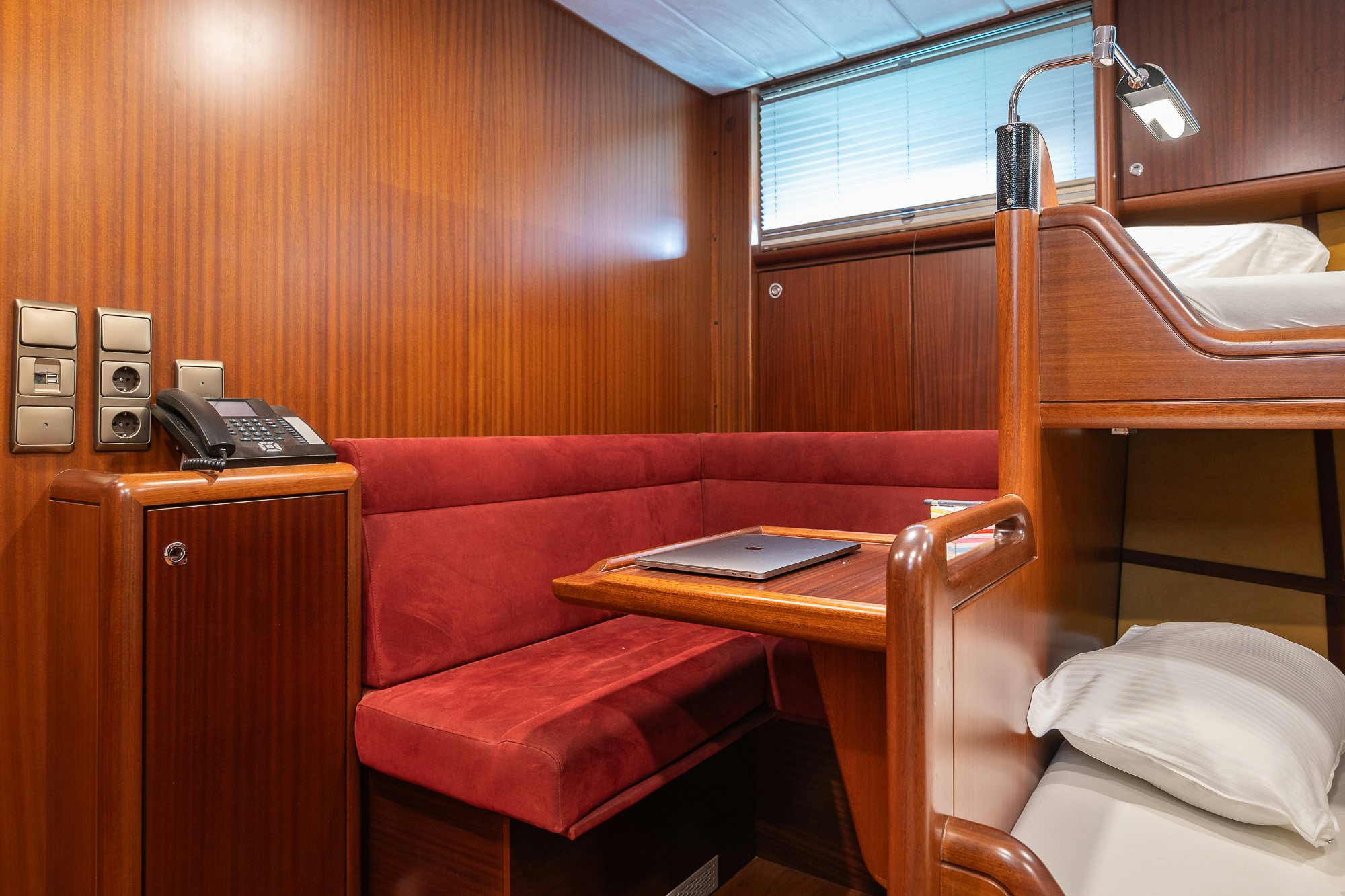 a room with a desk and a telephone aboard PLAYMOBIL Yacht for Sale