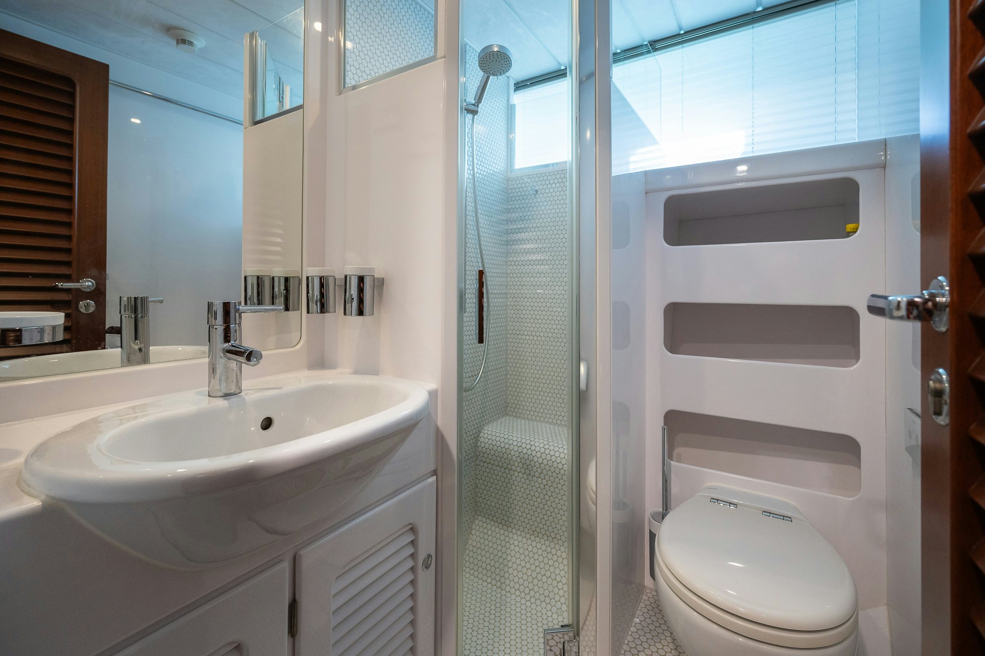 a bathroom with a glass shower door aboard PLAYMOBIL Yacht for Sale