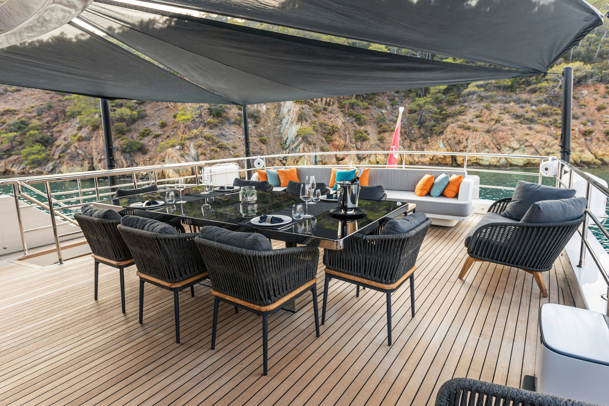 a patio with a table and chairs aboard ZEEMAR Yacht for Charter