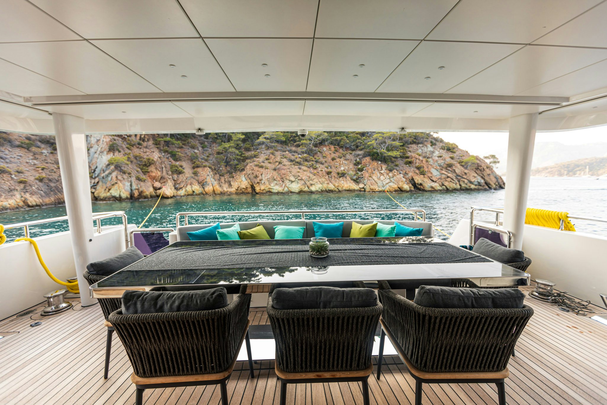 a table with chairs around it aboard ZEEMAR Yacht for Charter