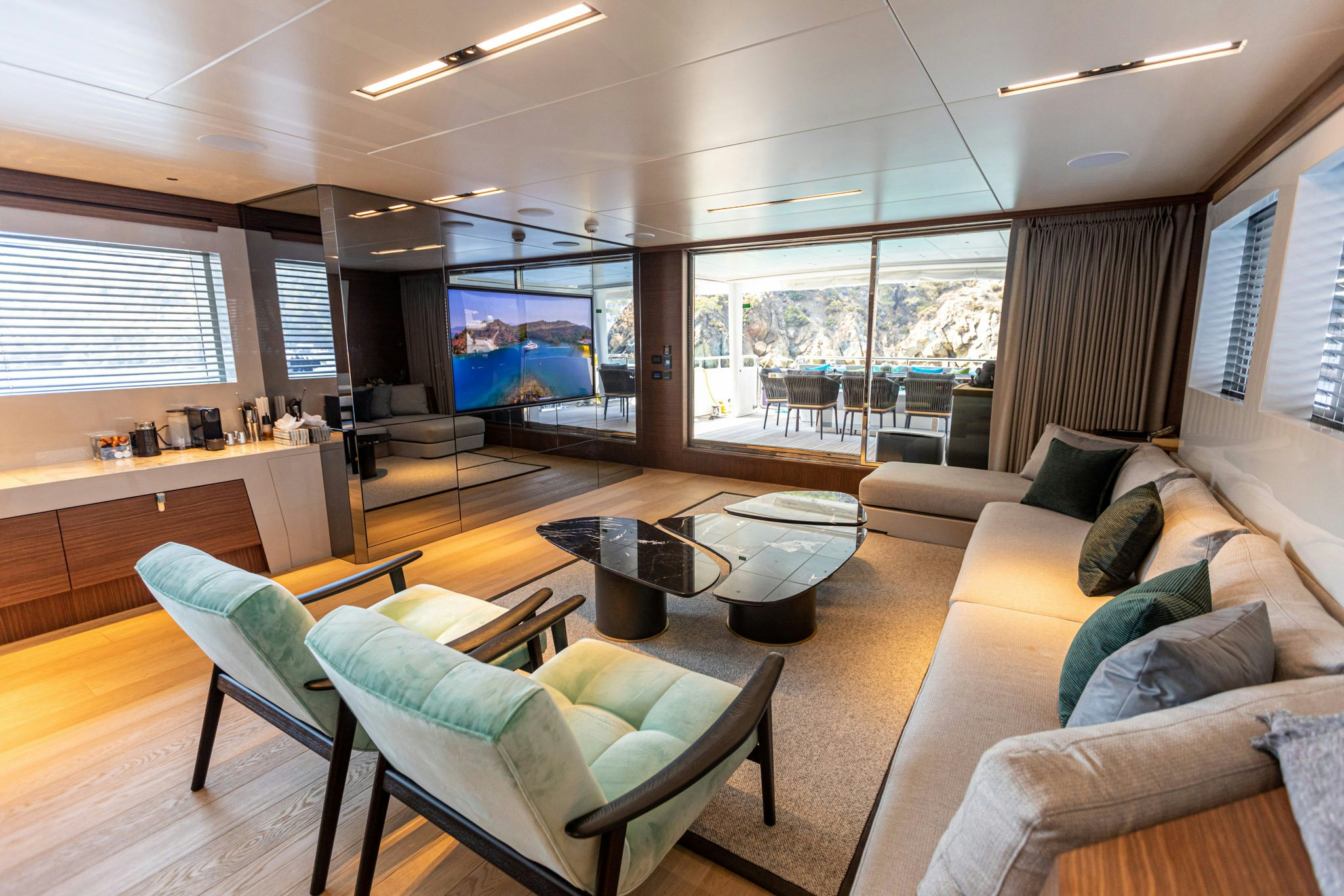 a living room with a large window aboard ZEEMAR Yacht for Charter