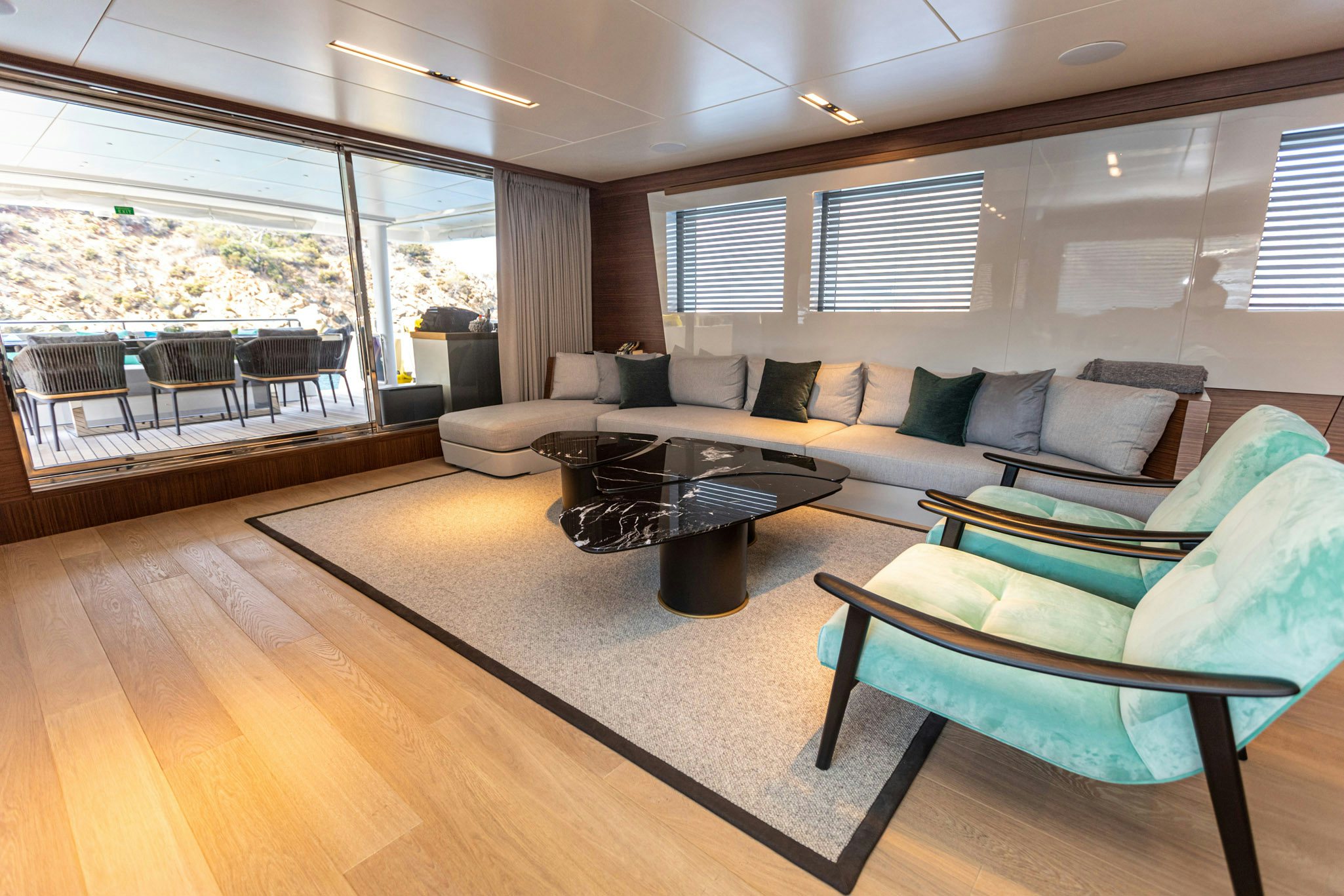 a living room with a couch and a coffee table aboard ZEEMAR Yacht for Charter