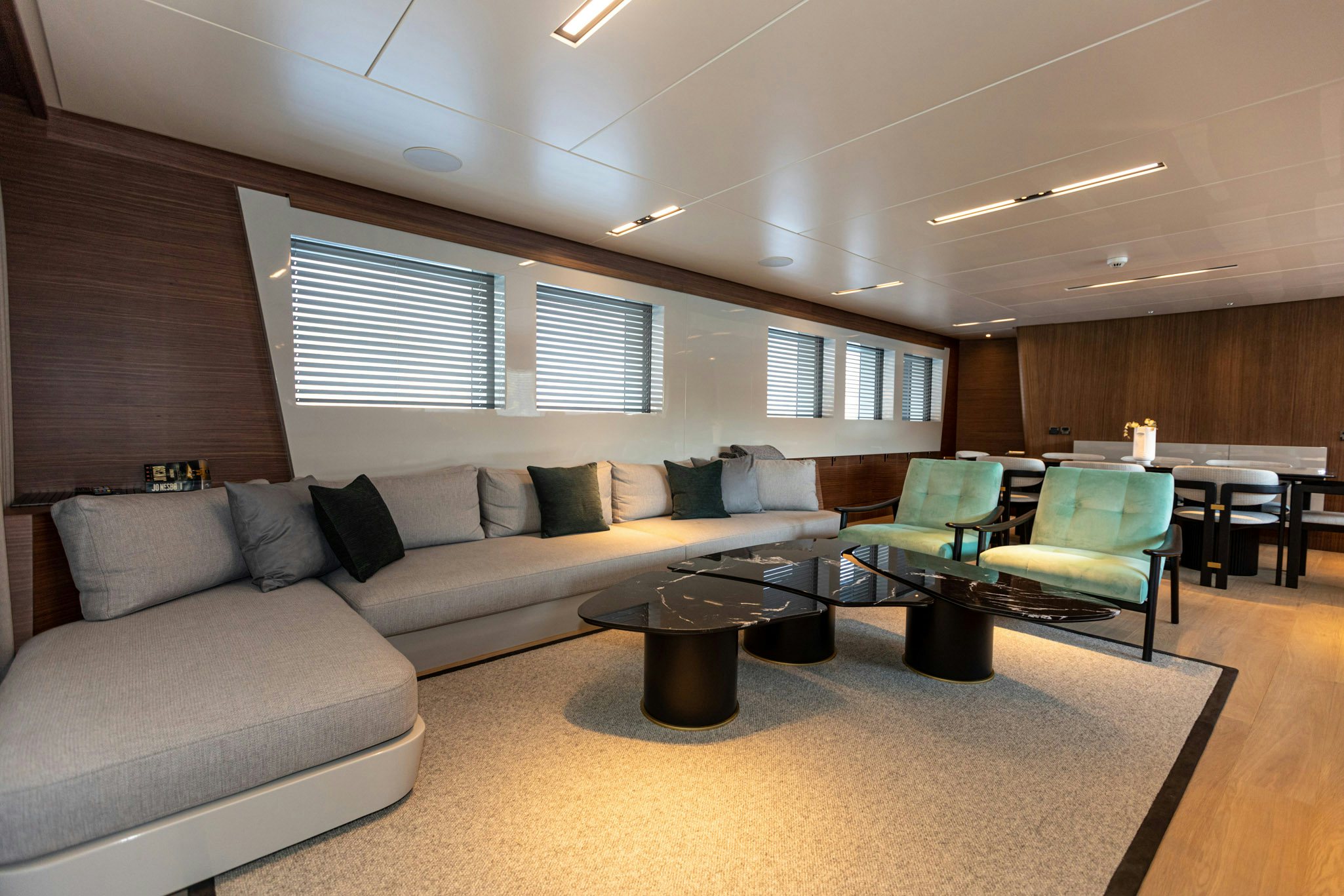 a living room with a couch and a coffee table aboard ZEEMAR Yacht for Charter