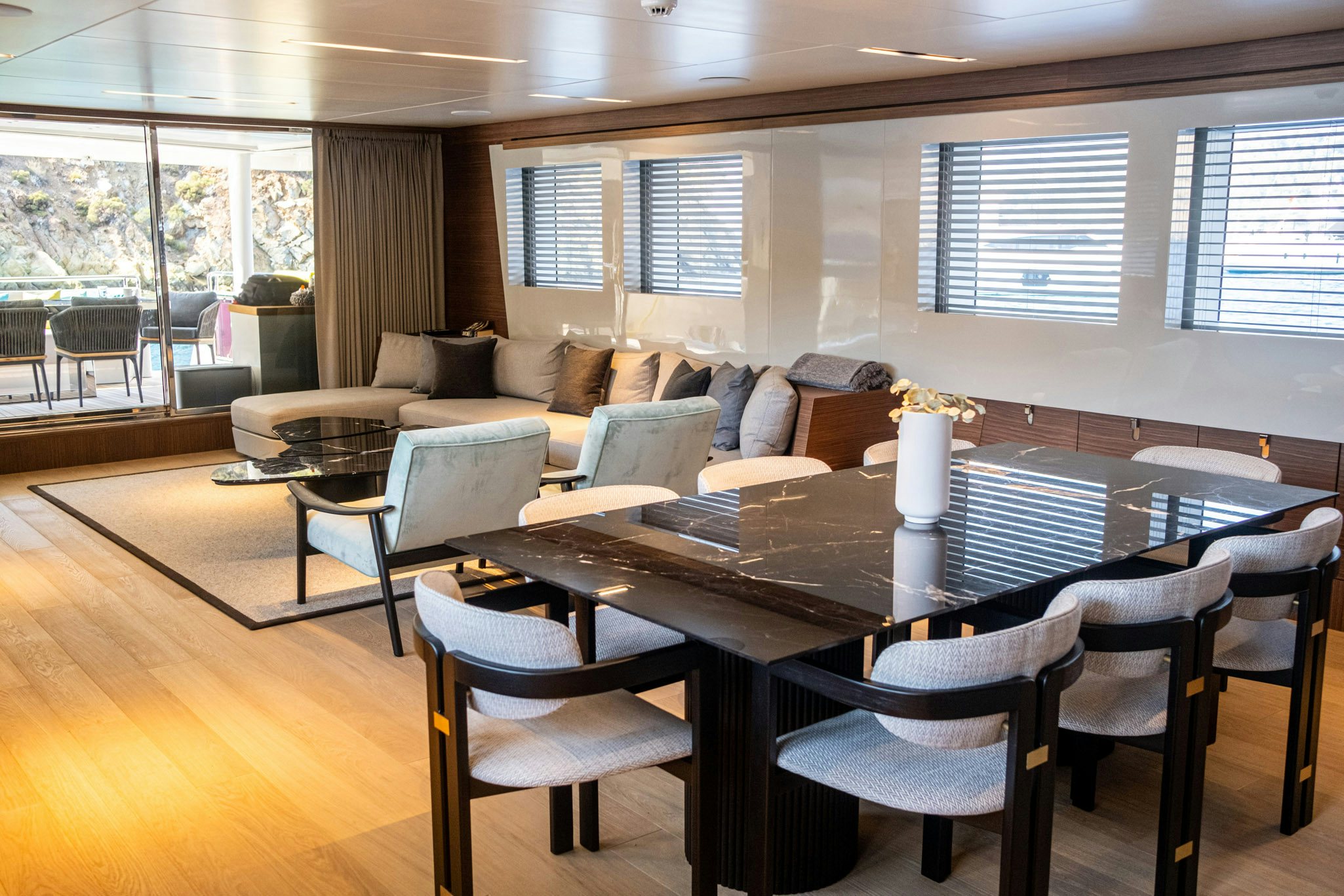 a large room with a table and chairs aboard ZEEMAR Yacht for Charter