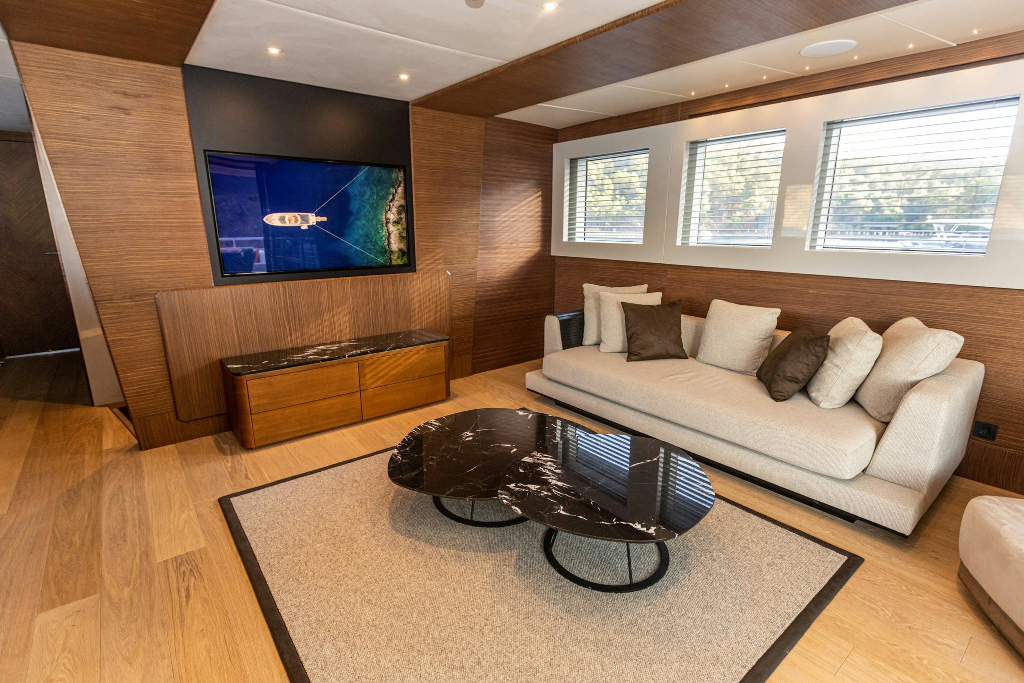 a living room with a couch and a tv aboard ZEEMAR Yacht for Charter