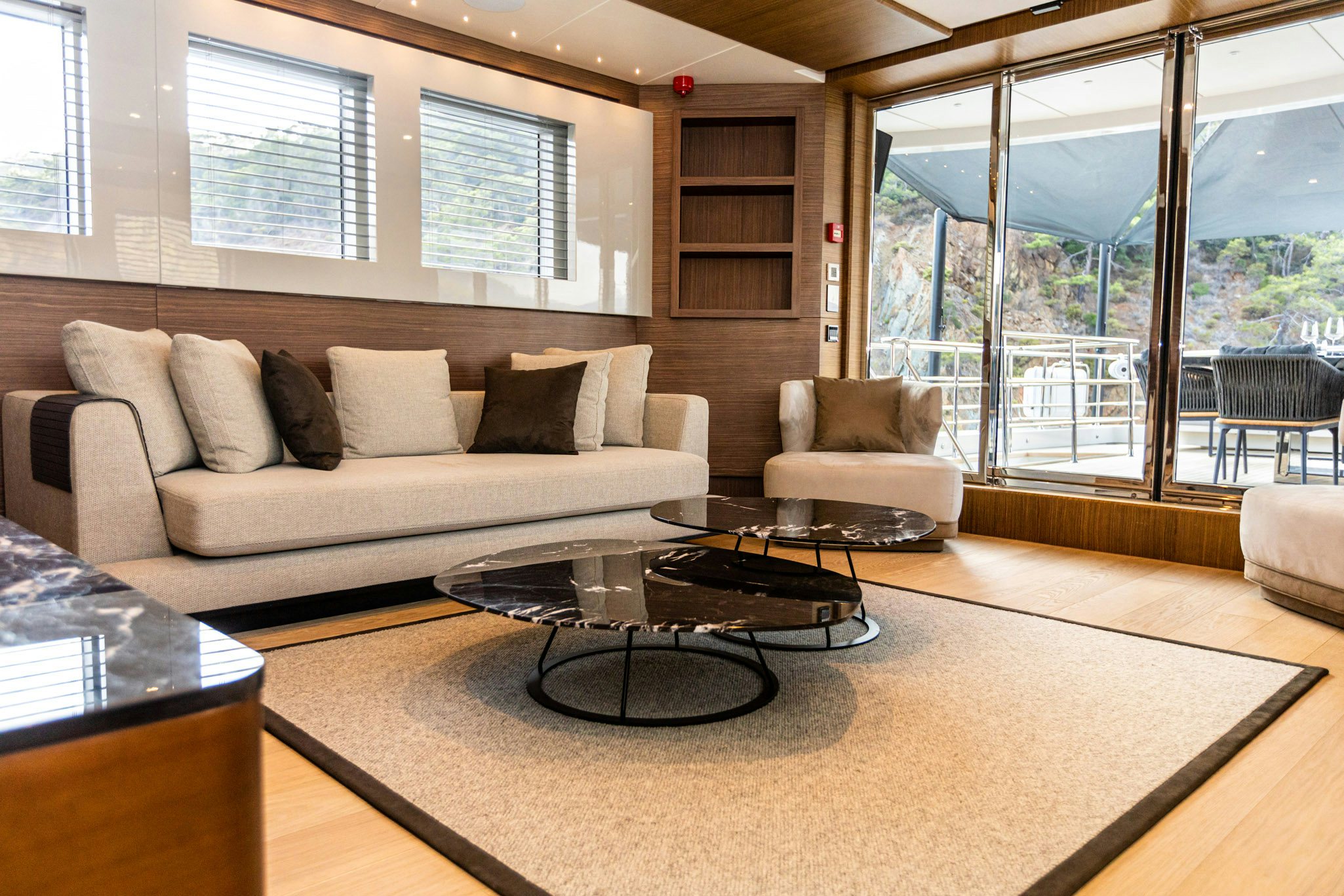 a living room with a large window aboard ZEEMAR Yacht for Charter