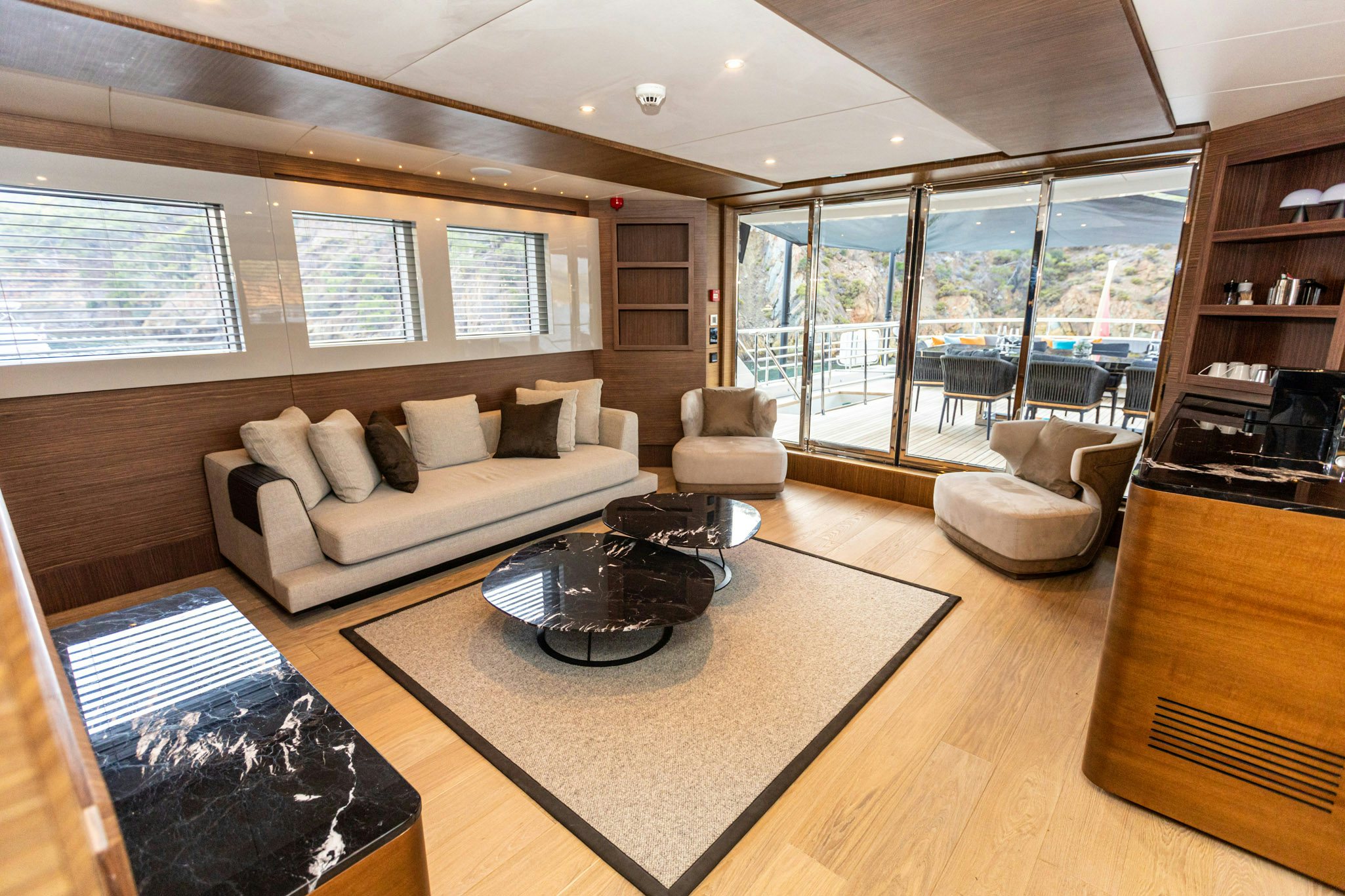 a living room with a large window aboard ZEEMAR Yacht for Charter