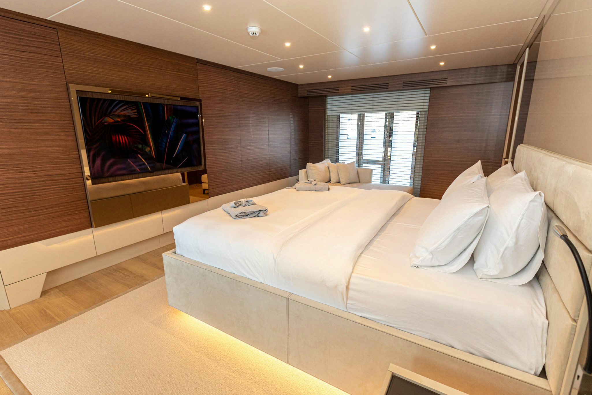 a large bed in a room aboard ZEEMAR Yacht for Charter