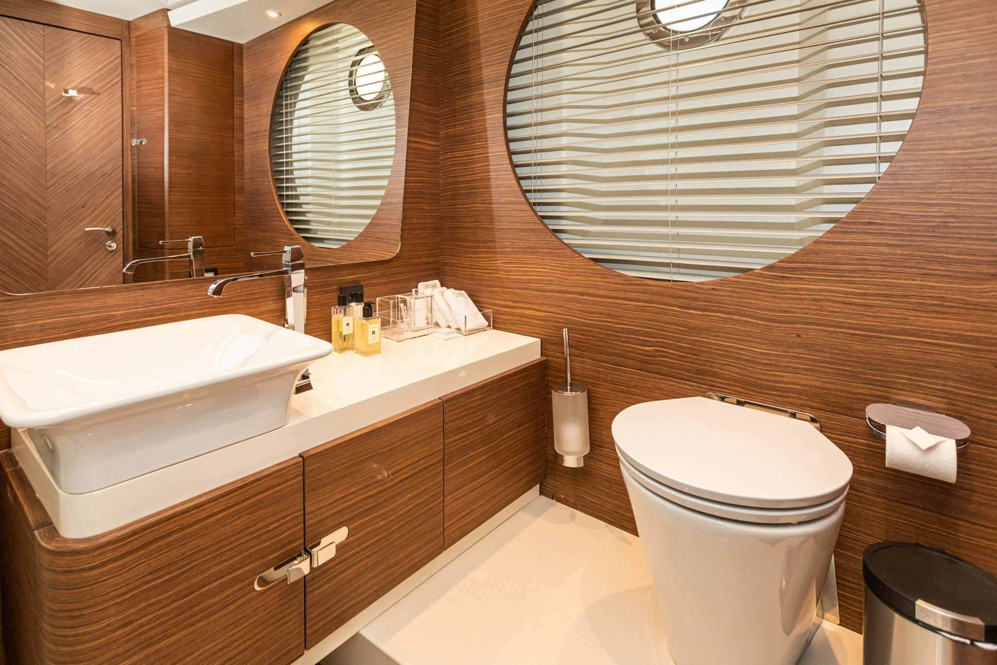 a bathroom with a sink toilet and a mirror aboard ZEEMAR Yacht for Charter