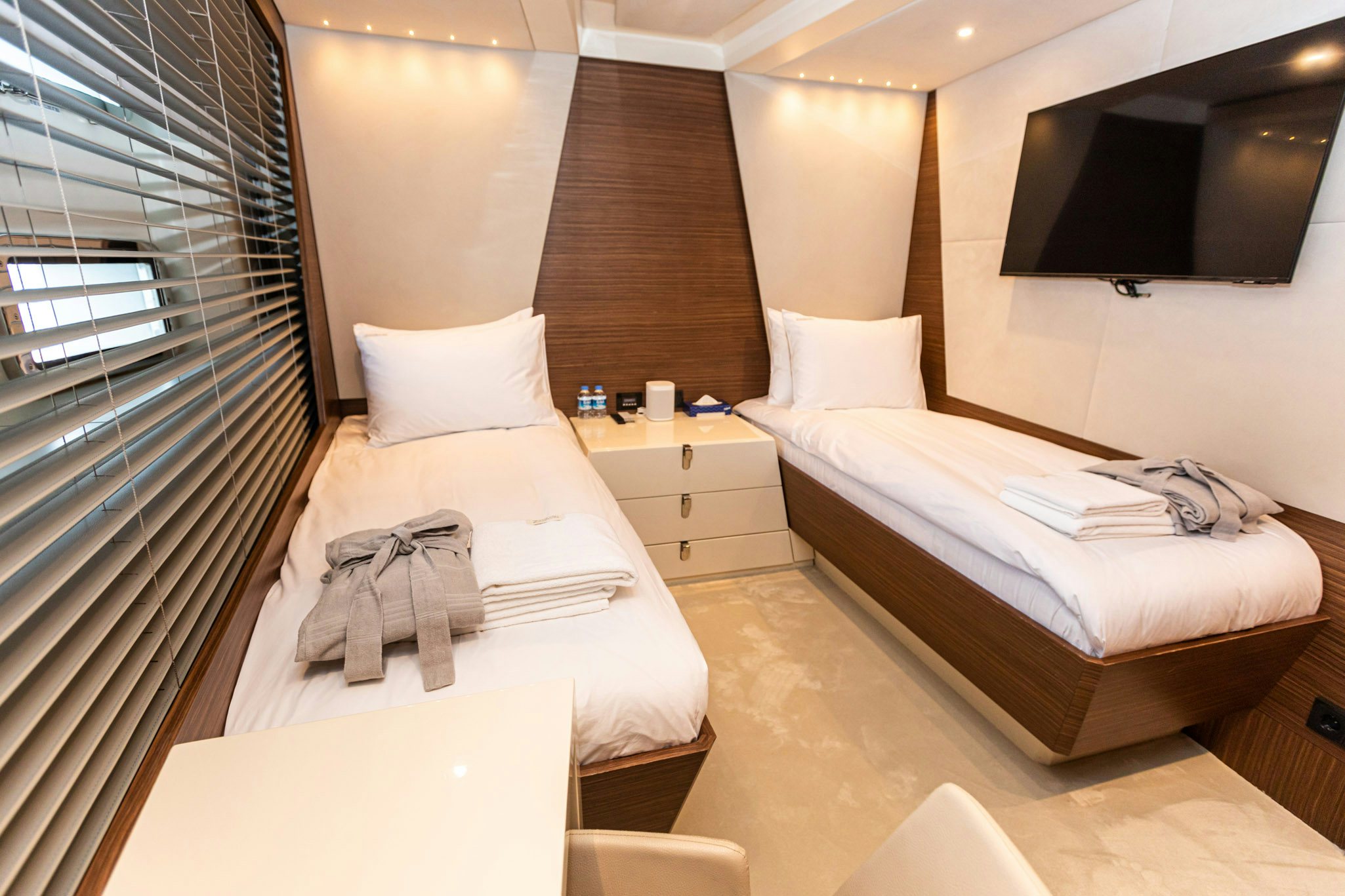 a couple of beds in a hotel room aboard ZEEMAR Yacht for Charter