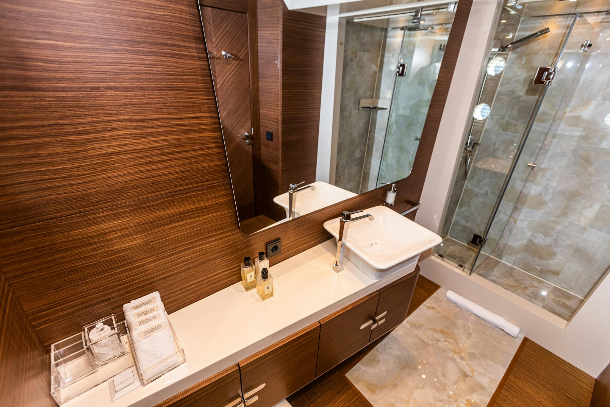 a bathroom with a large mirror aboard ZEEMAR Yacht for Charter