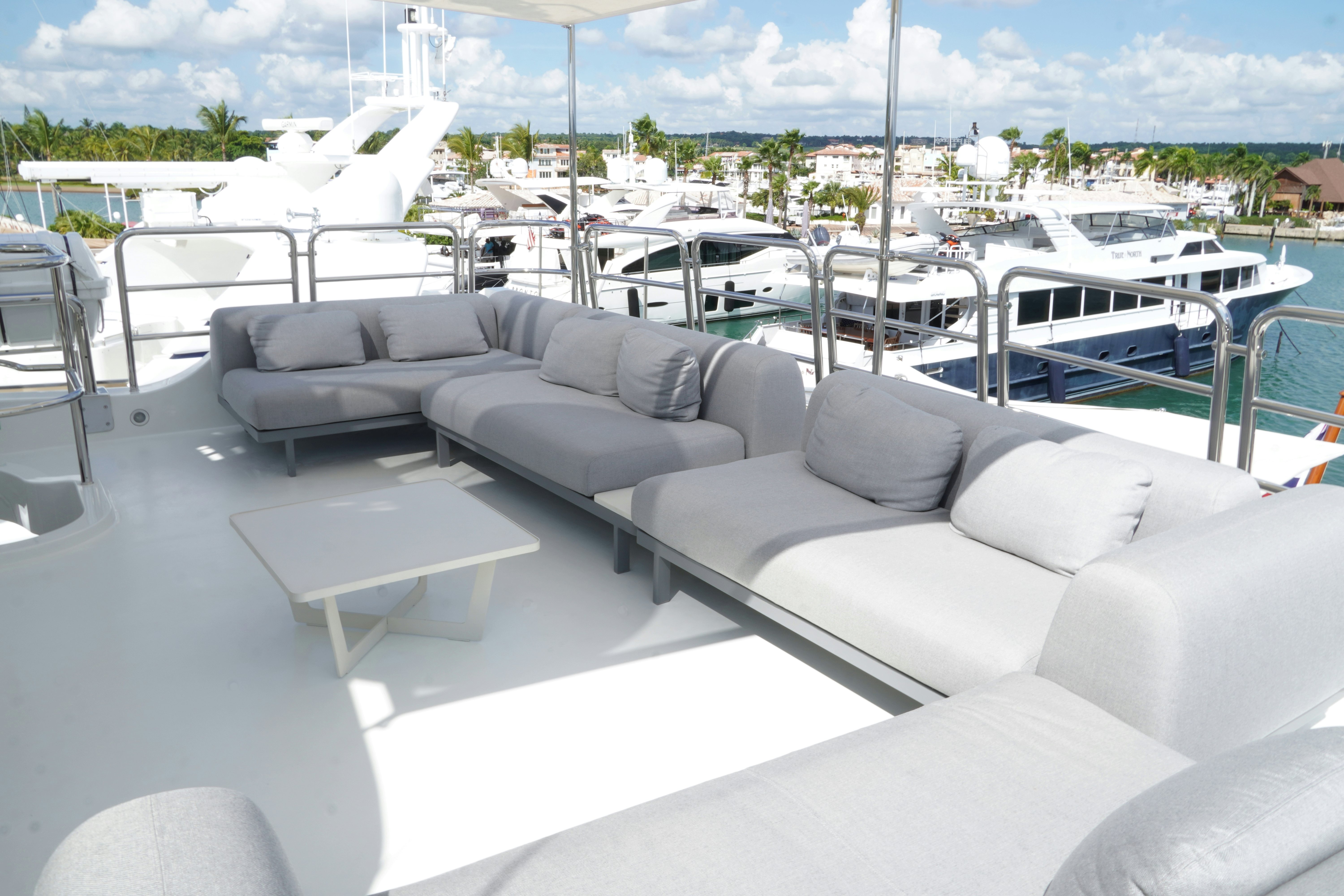 a room with couches and chairs aboard PAPAITO Yacht for Charter