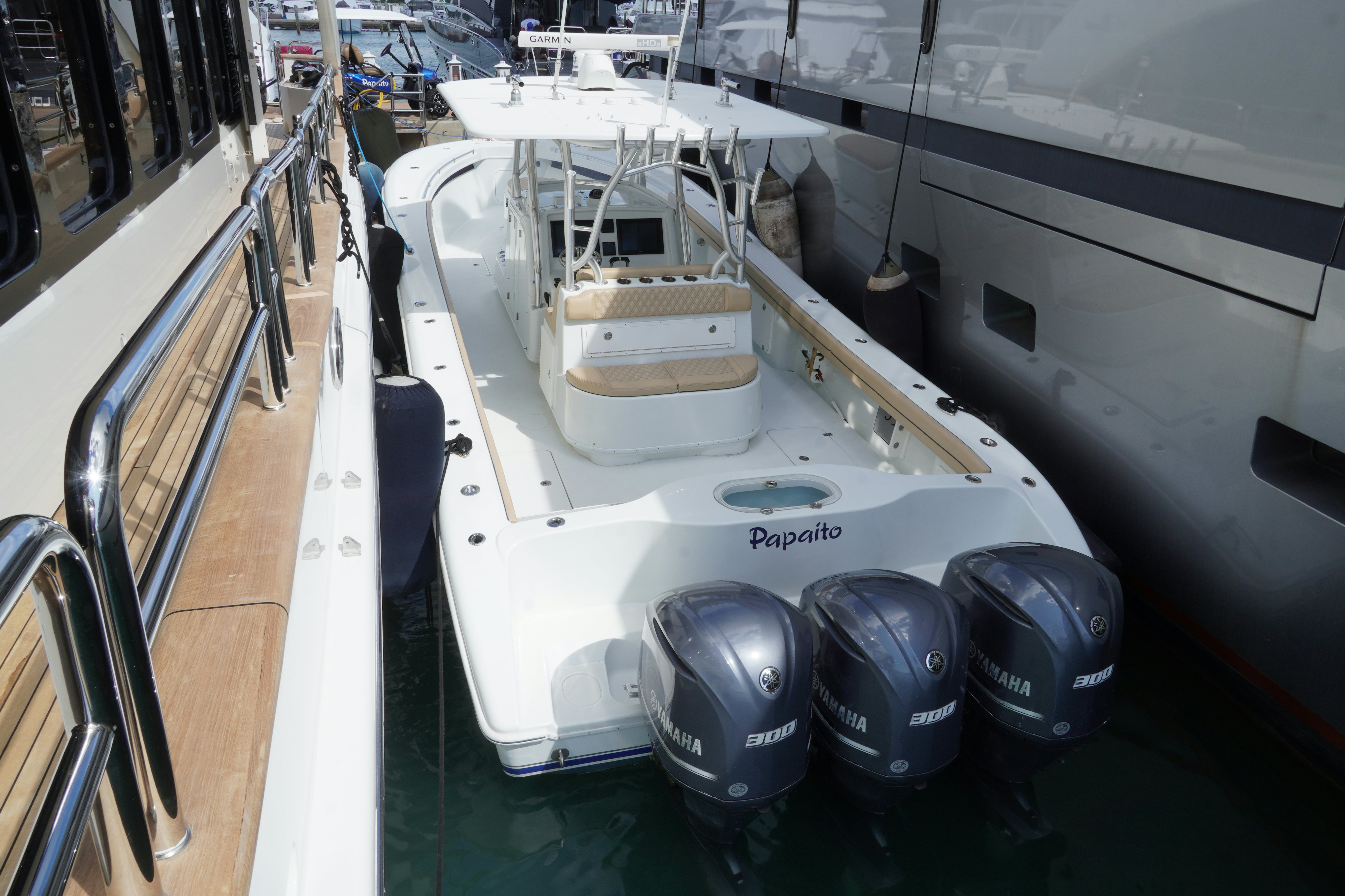 a white boat with a black and silver helmet on it aboard PAPAITO Yacht for Charter