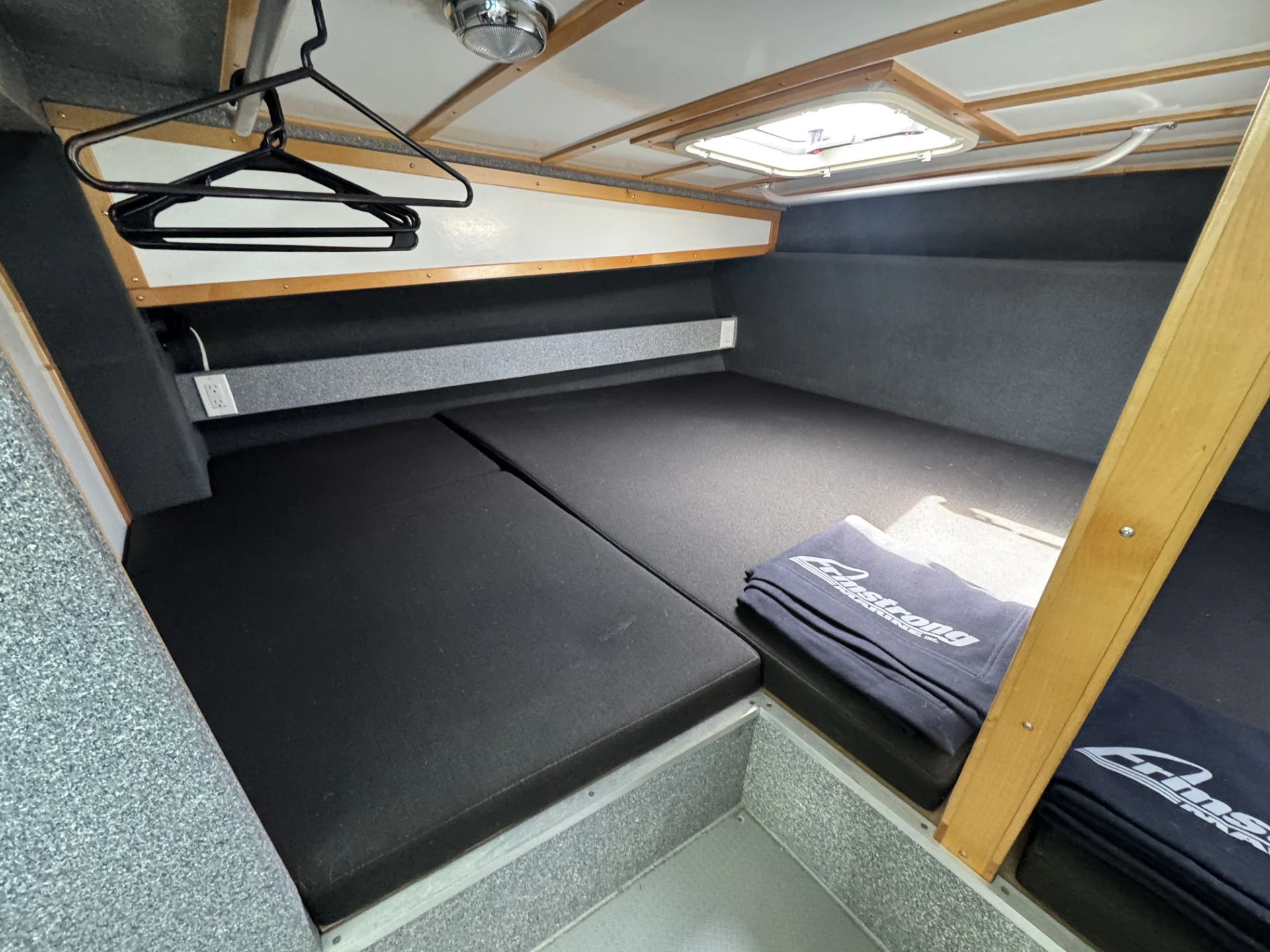 a desk with a computer and a laptop on it aboard ALKOA Yacht for Sale