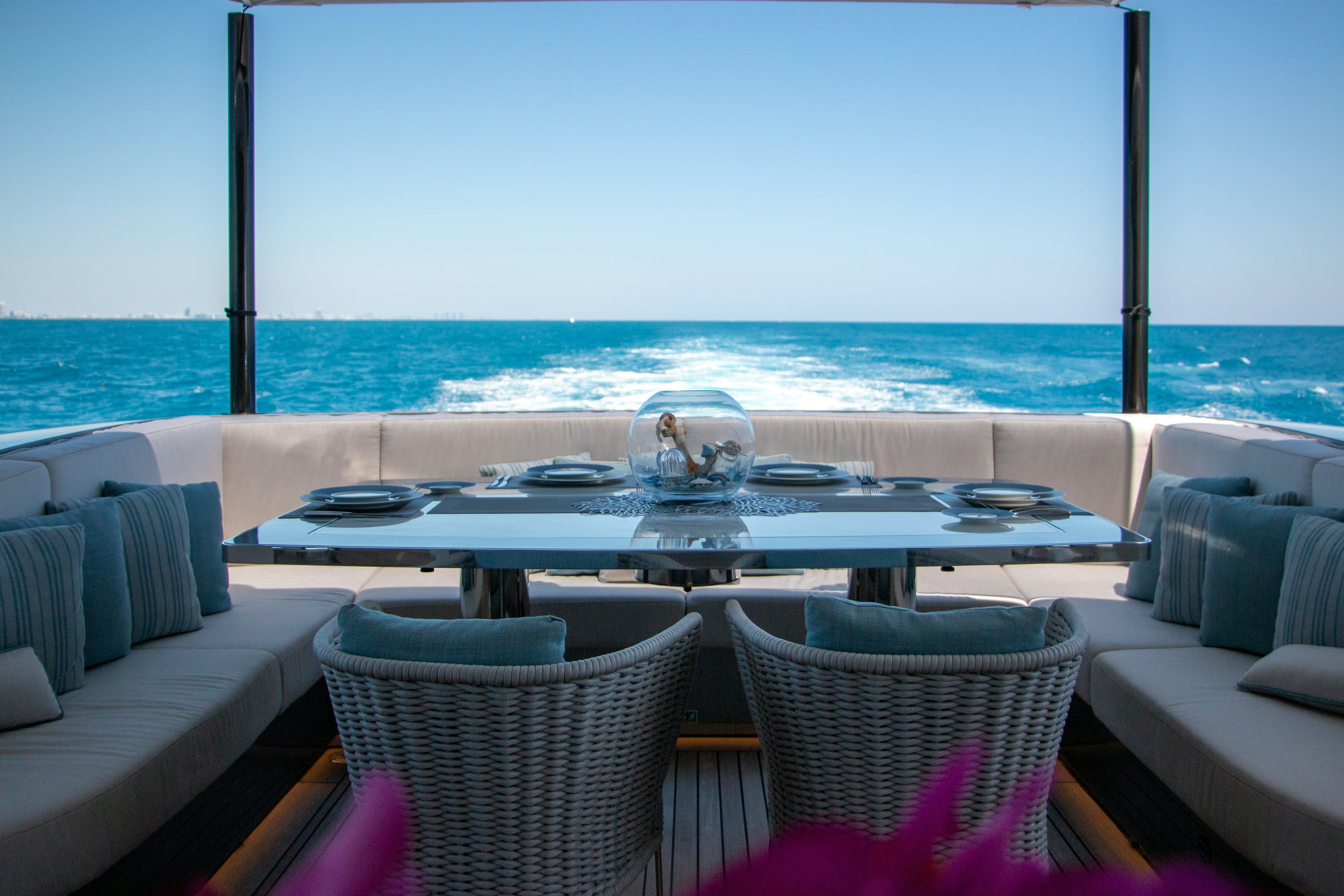 a room with a table and chairs aboard EIV Yacht for Sale