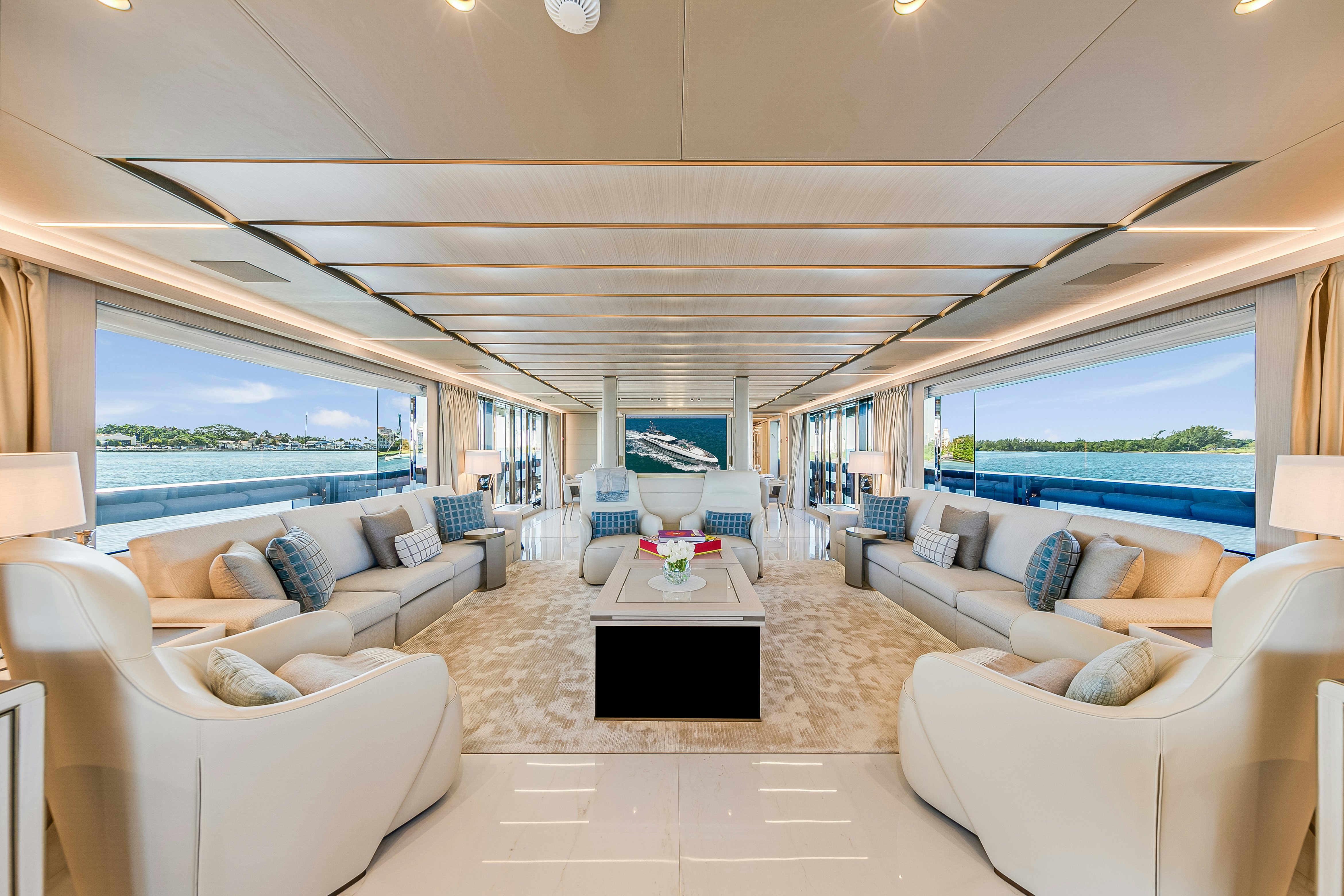 a living room with a large window aboard EIV Yacht for Sale