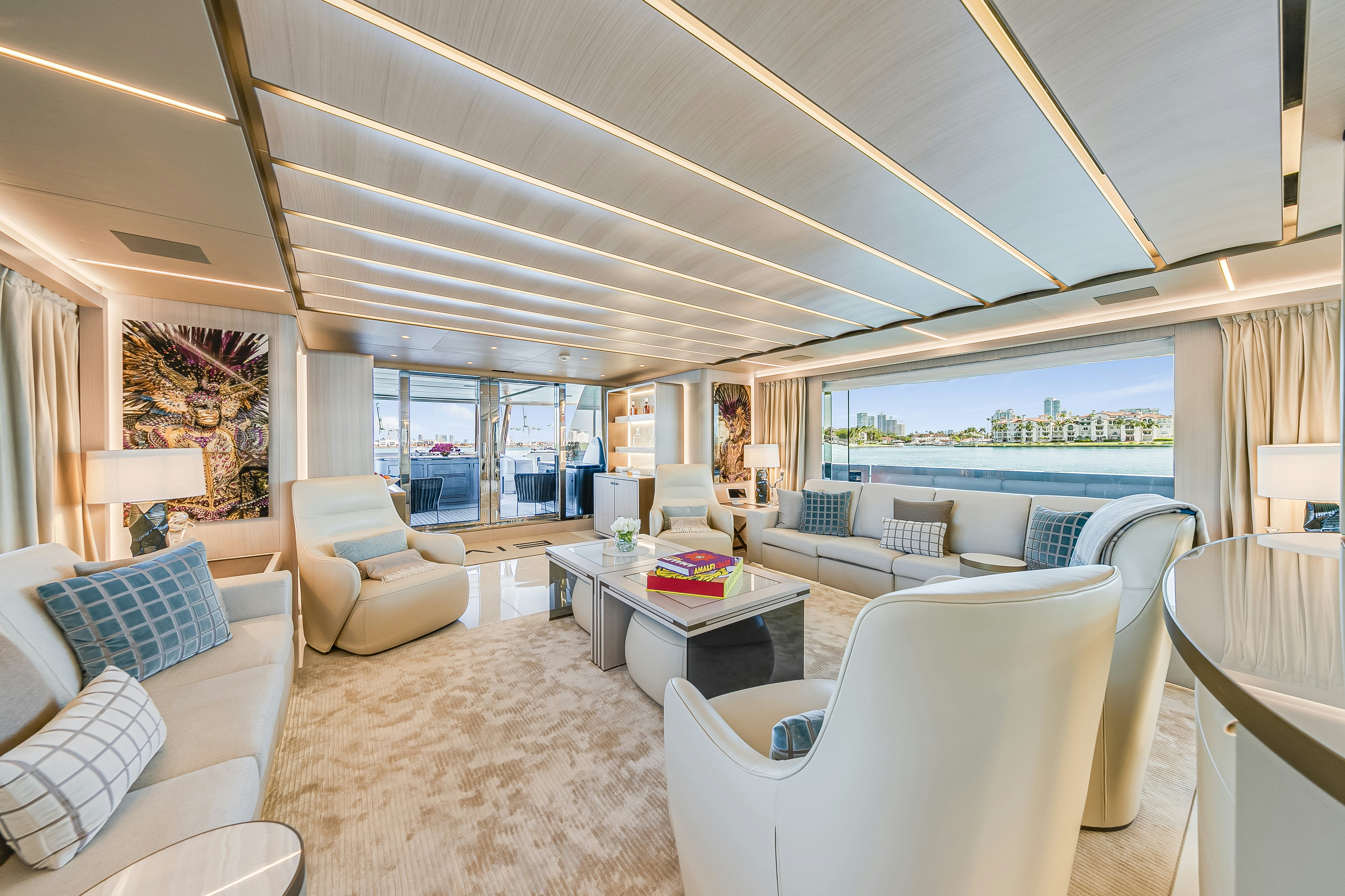 a living room with a large window aboard EIV Yacht for Sale