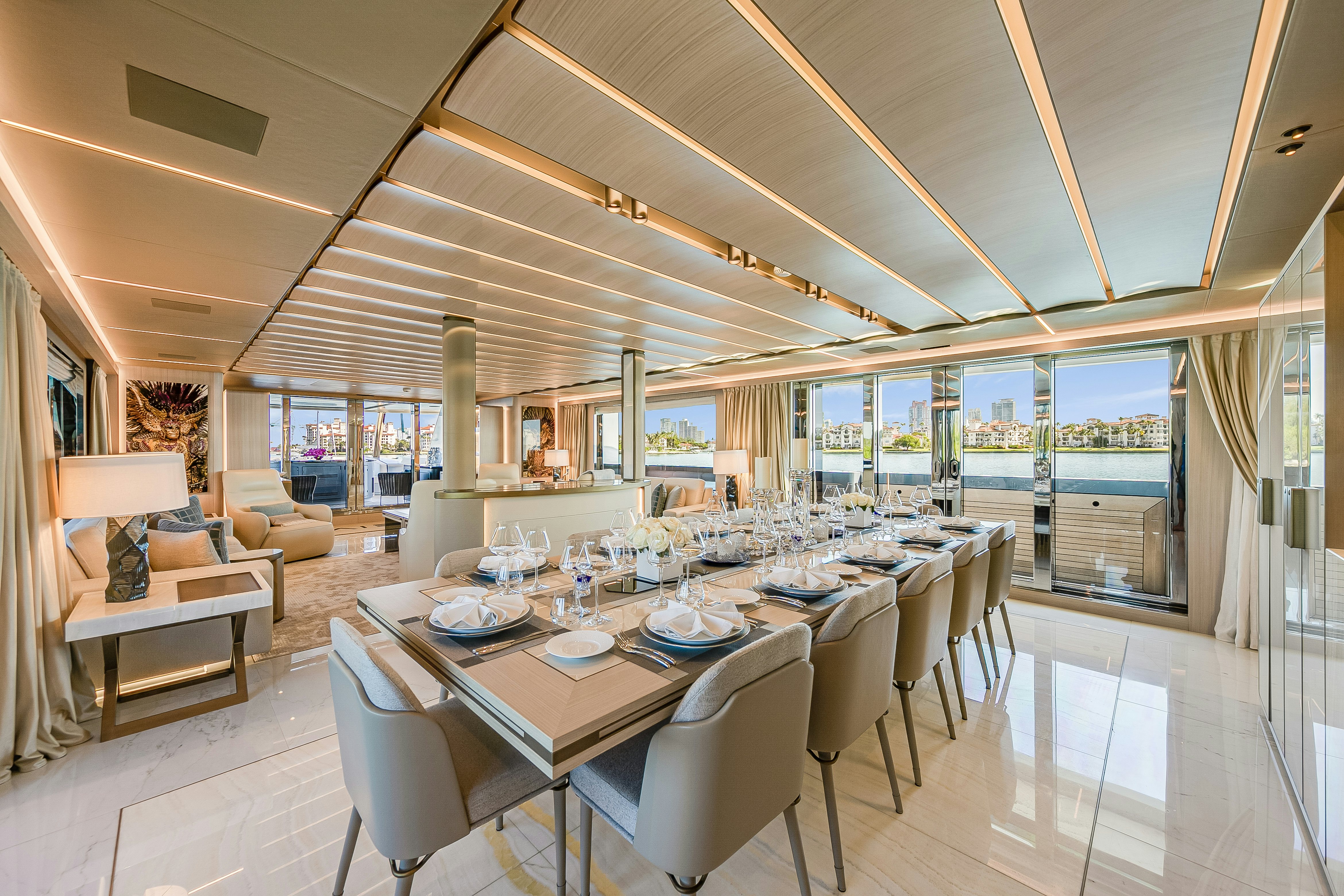 a large dining room with a large table and chairs aboard EIV Yacht for Sale