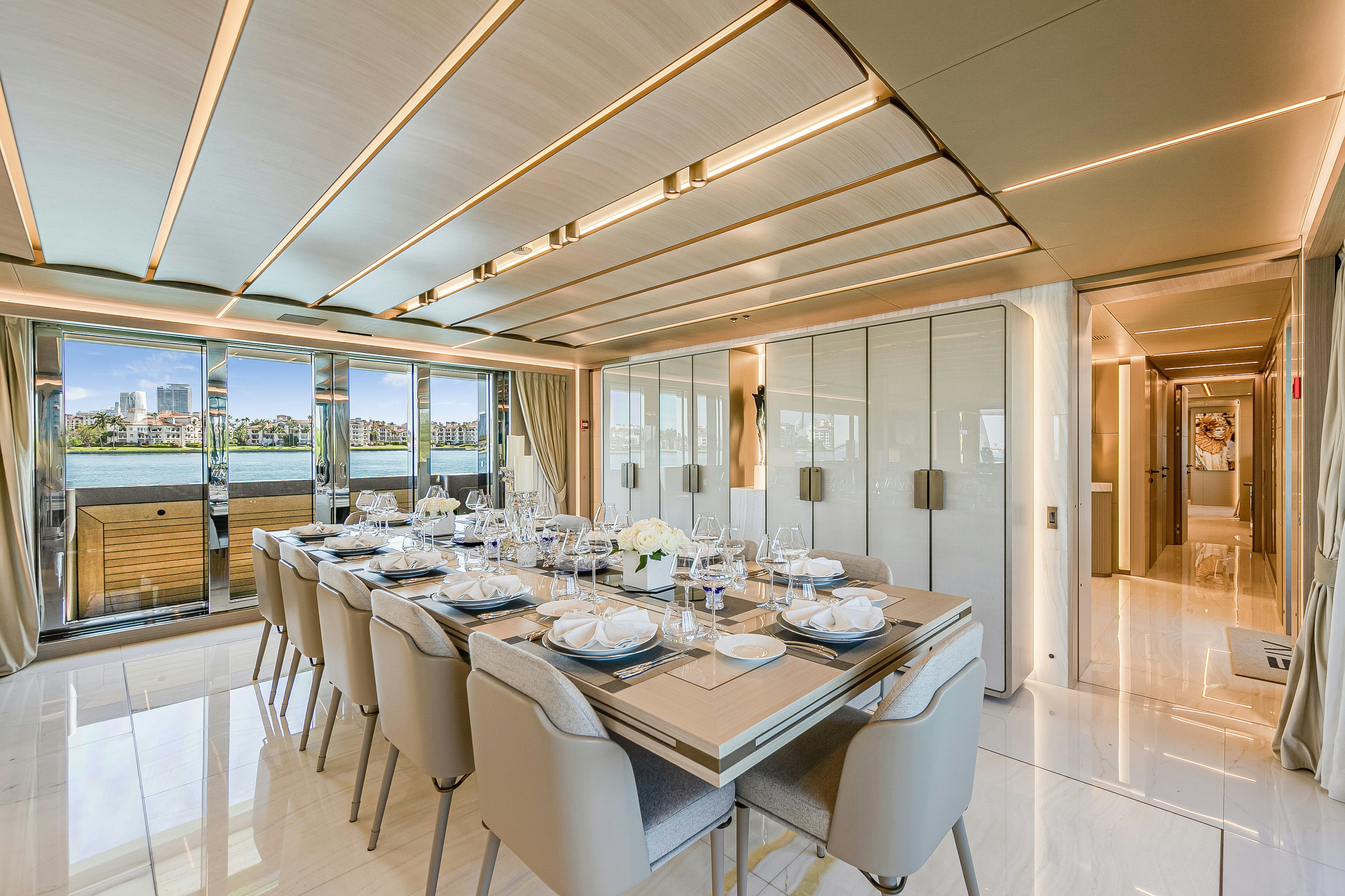 a dining room with a large table aboard EIV Yacht for Sale