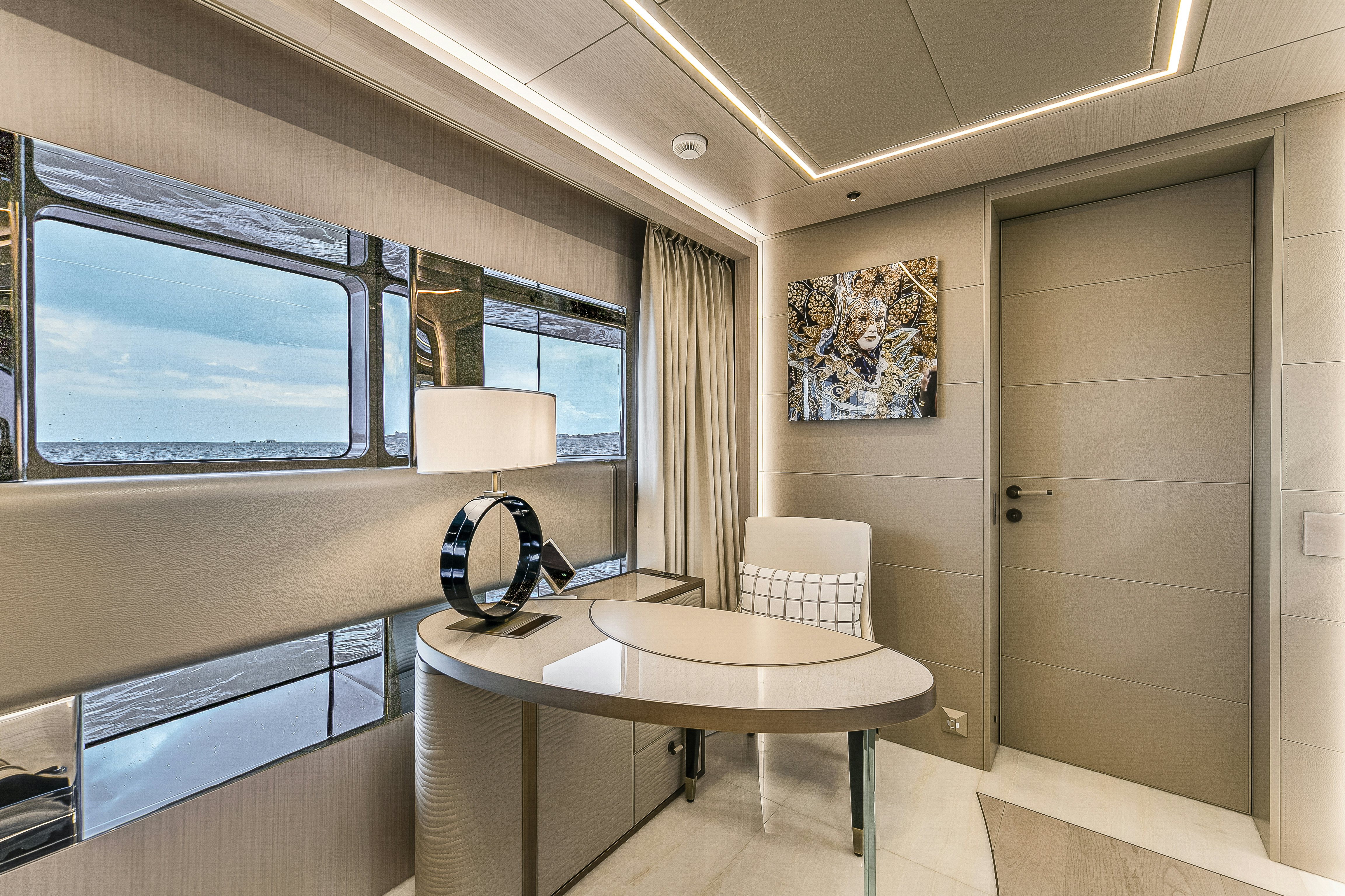 a room with a table and chairs aboard EIV Yacht for Sale