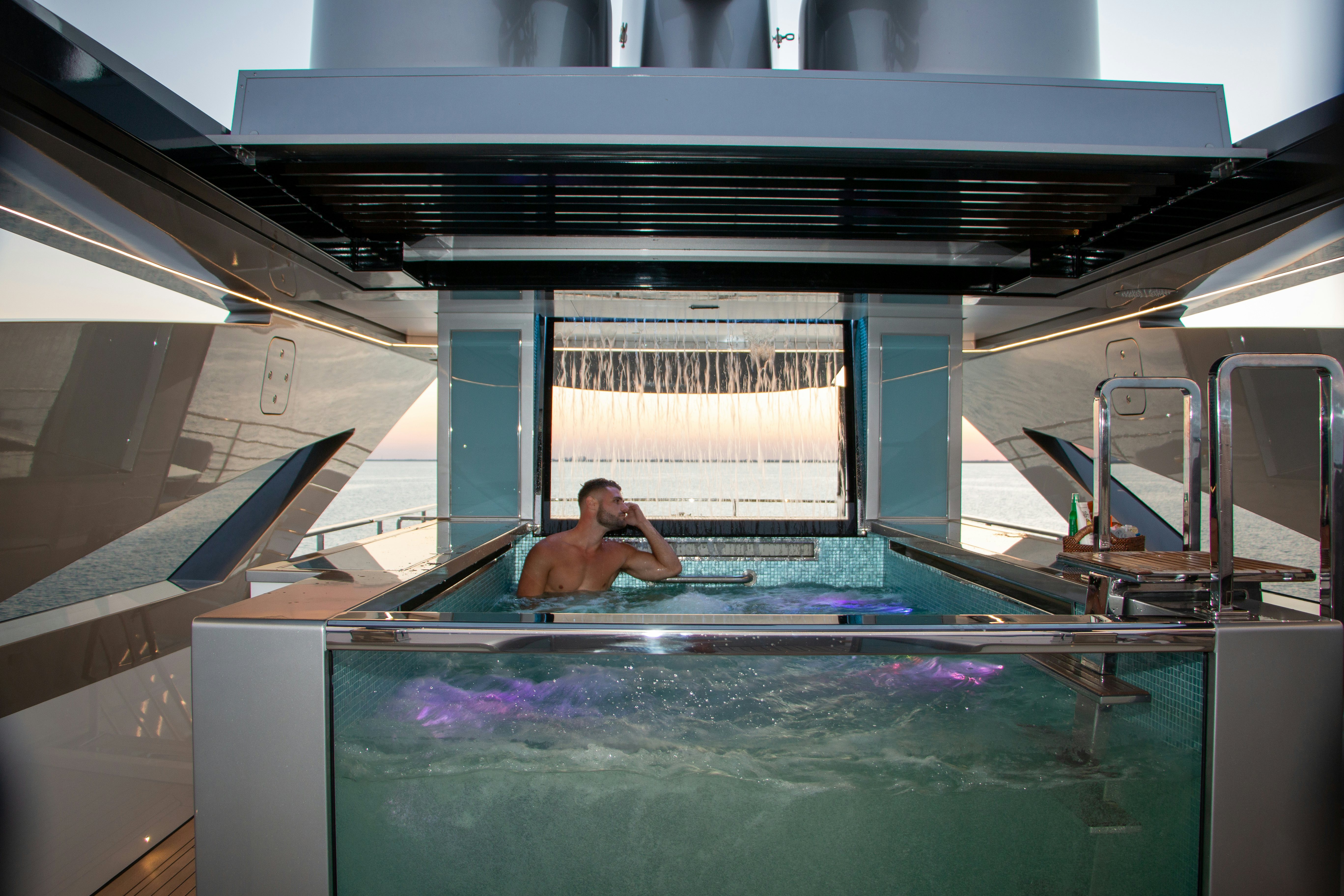 a man in a pool aboard EIV Yacht for Sale