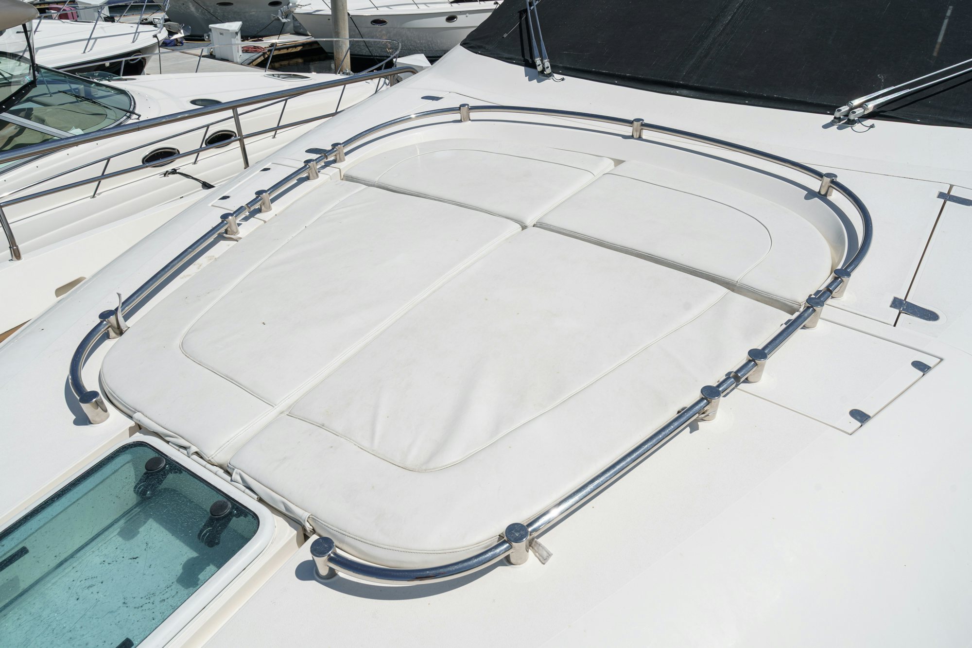 a white boat with a white sail aboard COMPASS ROSE Yacht for Sale