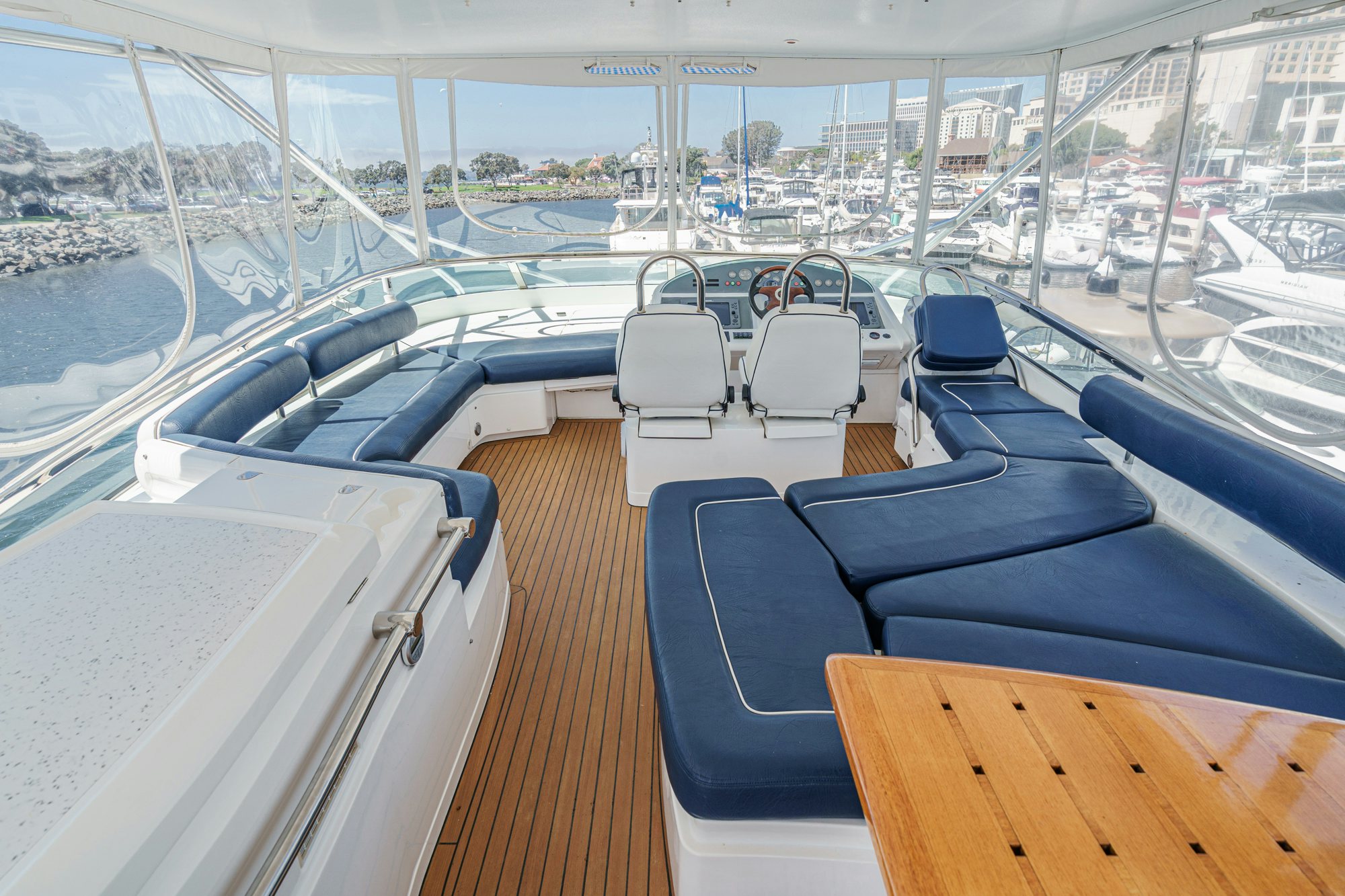 a boat deck with many seats aboard COMPASS ROSE Yacht for Sale