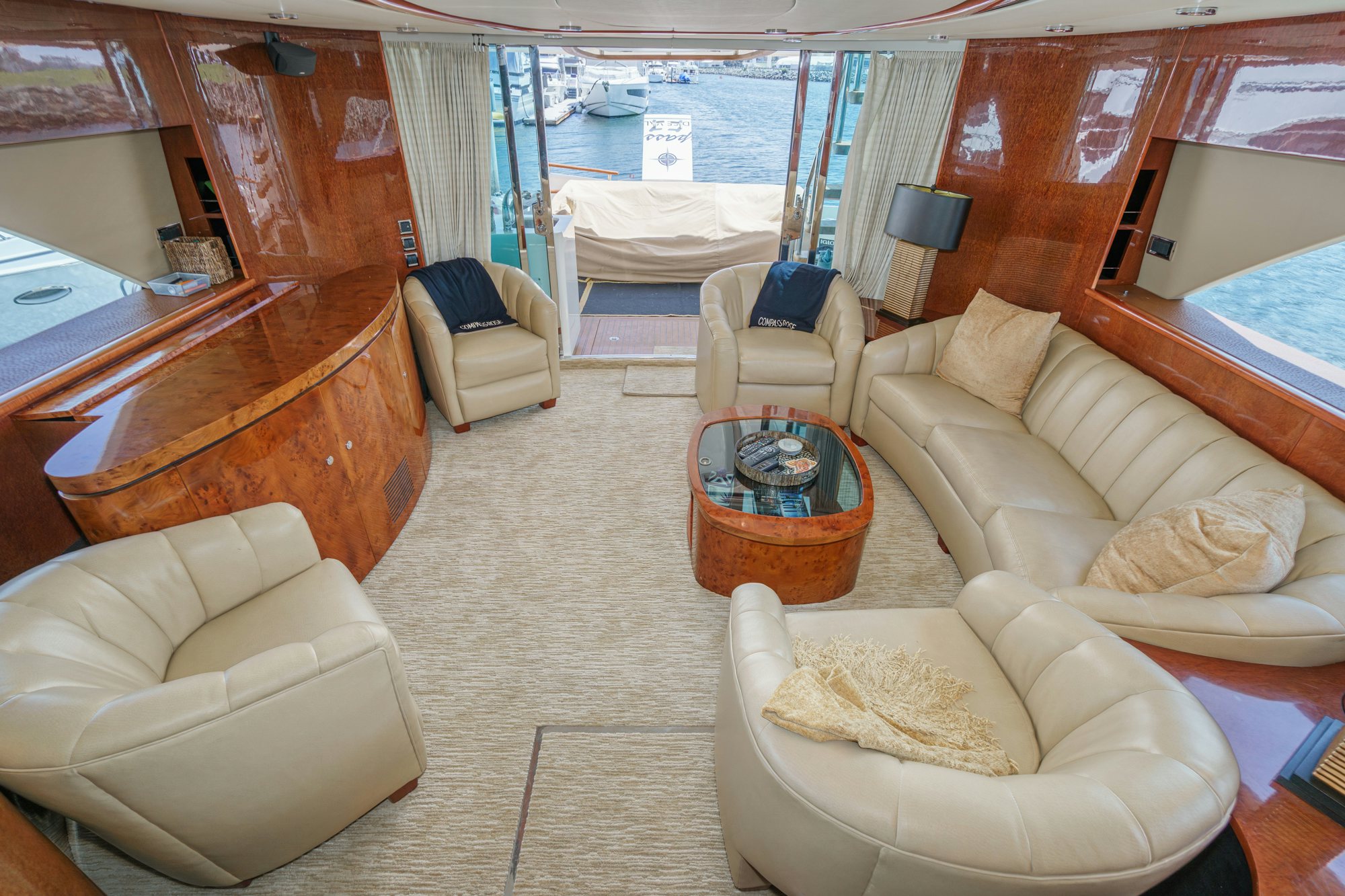 a living room with a bed and a chair aboard COMPASS ROSE Yacht for Sale