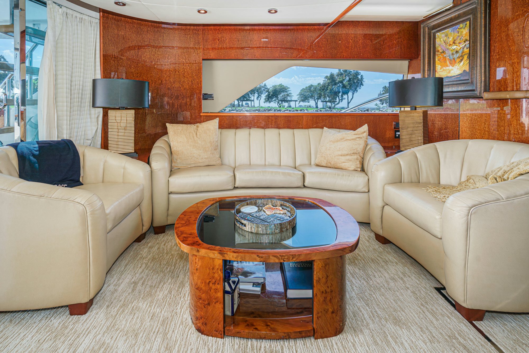 a living room with a table and couches aboard COMPASS ROSE Yacht for Sale