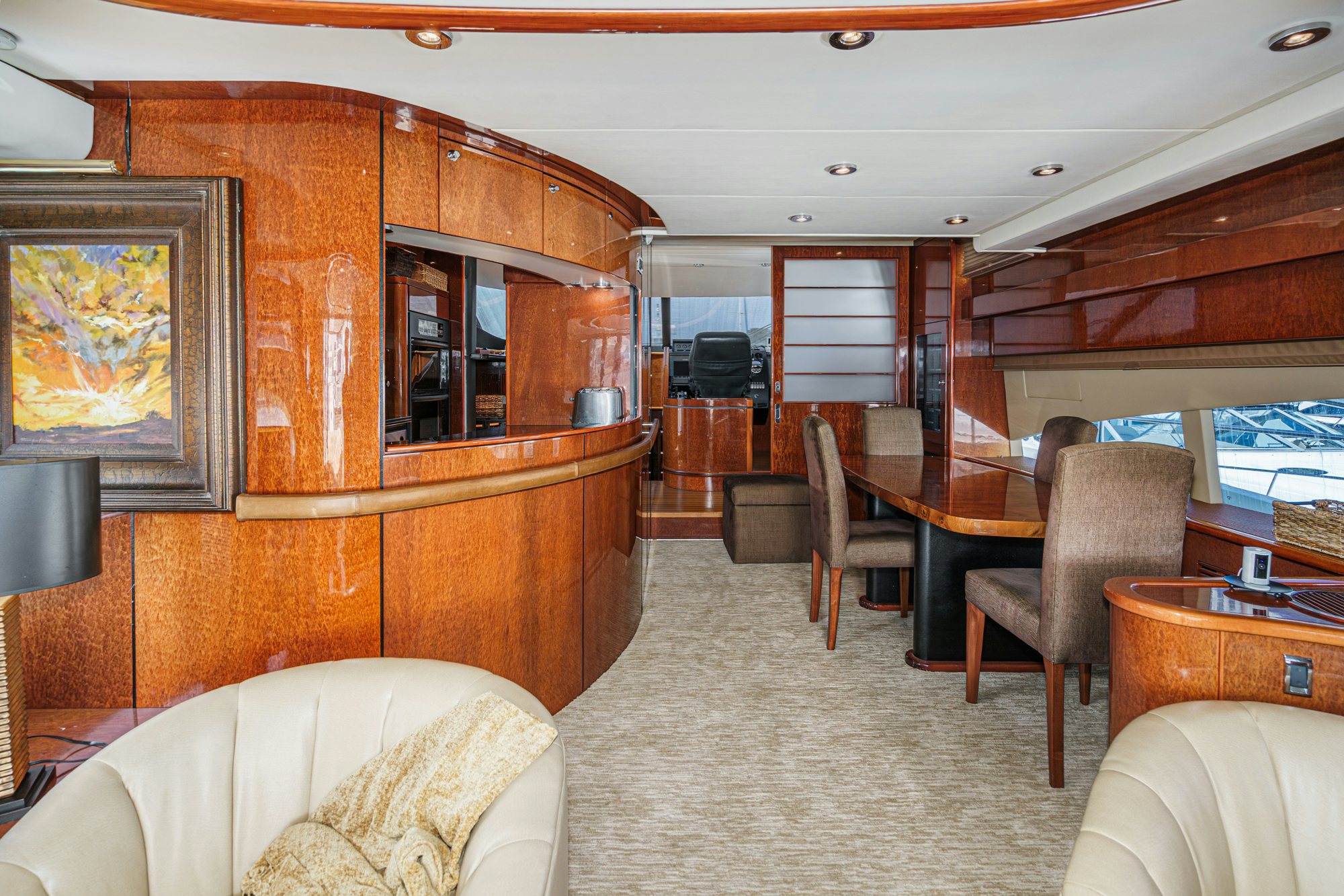 a living room with a wood cabinet aboard COMPASS ROSE Yacht for Sale